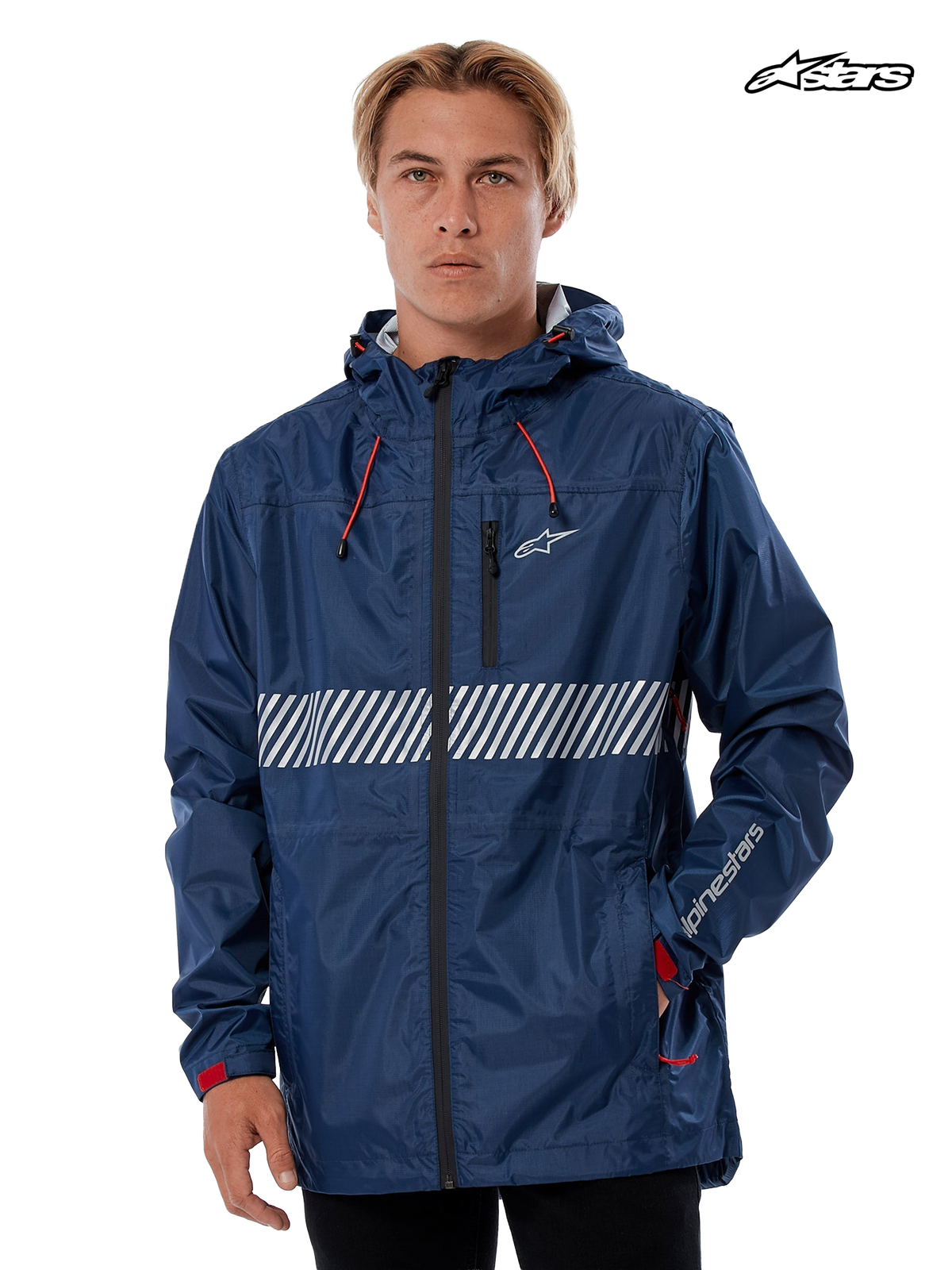 Alpinestars Fusion Rain Jacket, waterproof hard-shell rain jacket in navy, worn by a model, featuring a fixed hood with bungee adjusters, white chest graphic, and reflective details.
