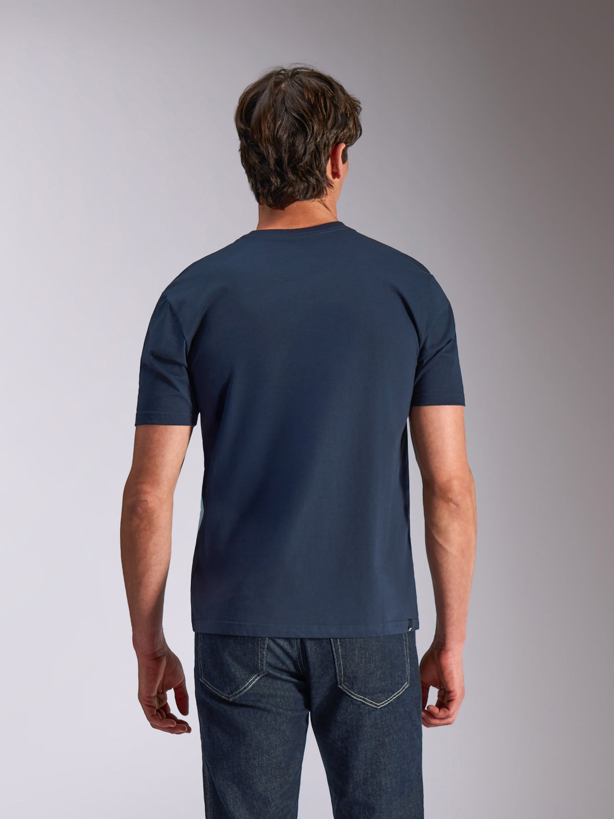 Alpinestars Ageless Shadow CSF Tee, Short Sleeve T-Shirt, Navy Blue, back view, worn by model with dark denim, casual motorsport lifestyle clothing