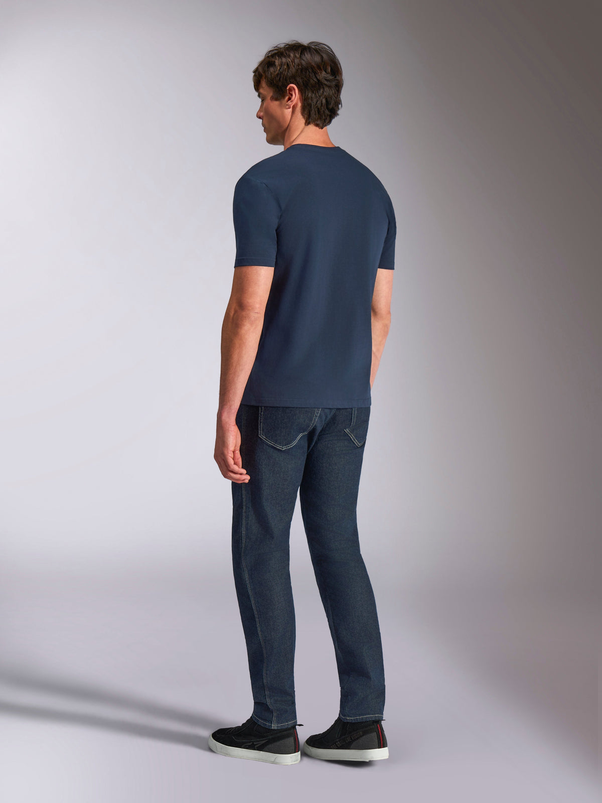 Alpinestars Ageless Shadow CSF Tee, Short Sleeve T-Shirt, Navy, back view on model, worn with dark denim jeans and black sneakers, casual lifestyle streetwear