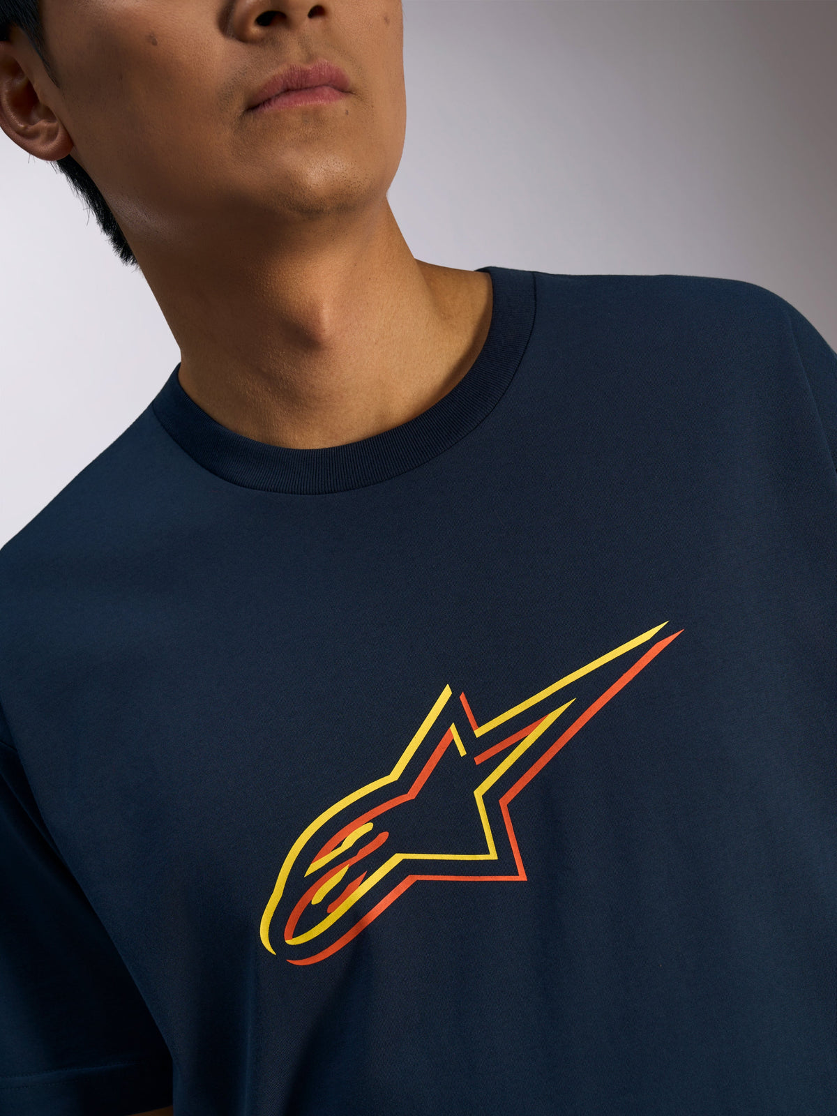 Alpinestars Ageless Shadow CSF Tee, Short Sleeve T-Shirt, Navy Blue, Orange and Yellow Shadow Star Logo Graphic, Casual Motorsport-Inspired Streetwear
