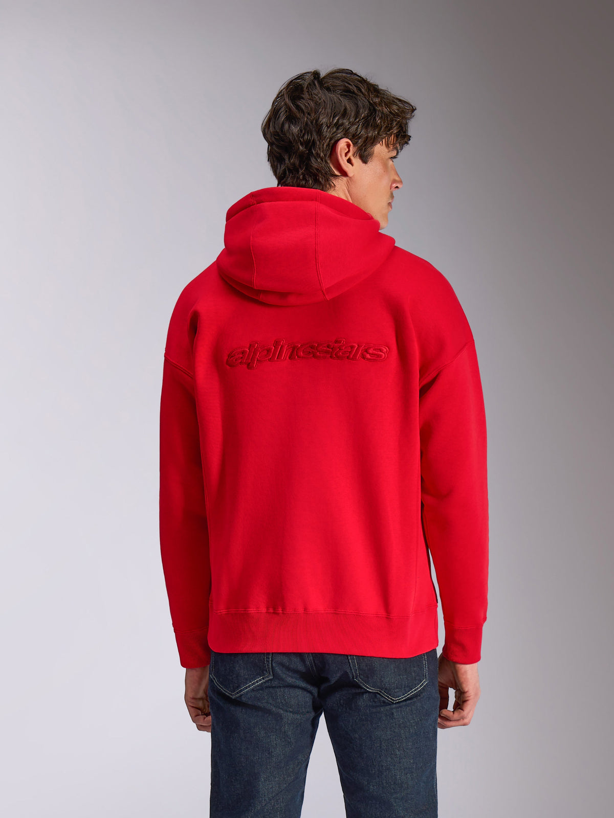 Alpinestars Emergent Oversized Hoodie, Red, back view on model, featuring tone-on-tone 3D embroidered Alpinestars word logo, oversized fit with ribbed hem and cuffs, casual motorsport-inspired streetwear