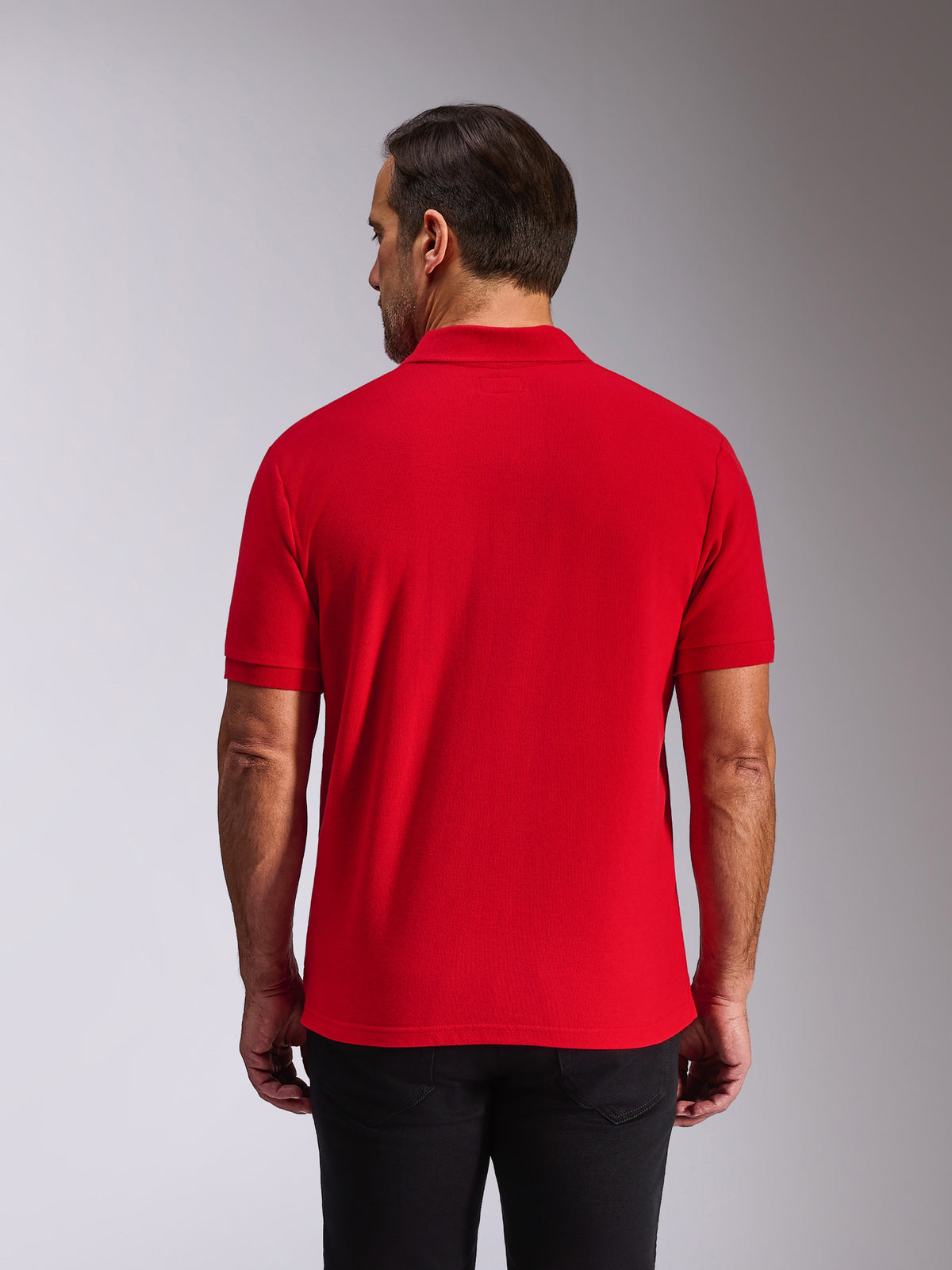 Alpinestars Endeavor Classic Polo, Short Sleeve Polo Shirt, Red, Back view on model, featuring ribbed collar and sleeve cuffs, casual motorsport-inspired streetwear