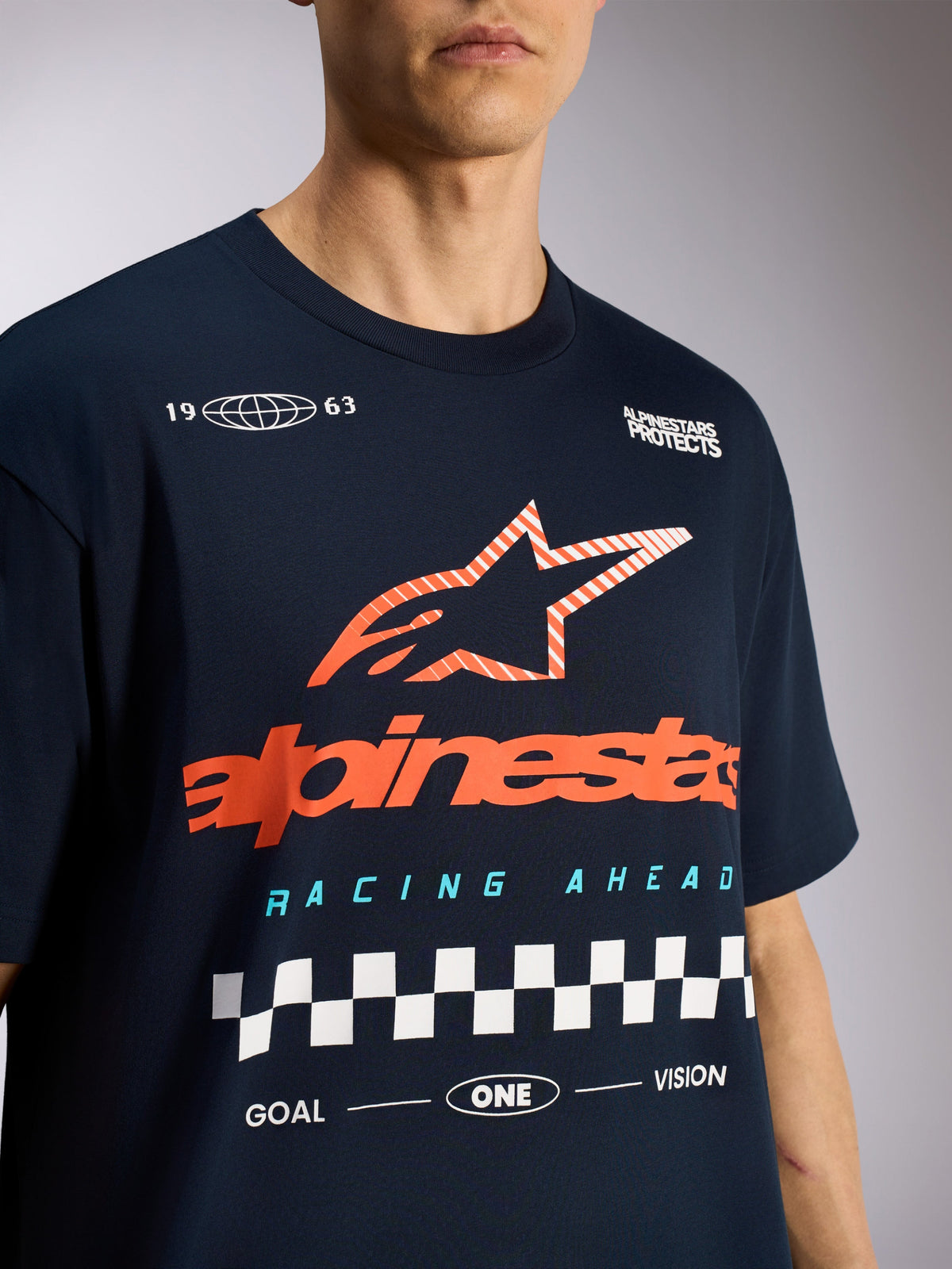 Alpinestars Aplomb Oversized CSF Tee, Short Sleeve T-Shirt, Navy Blue, Featuring large orange striped Astars star logo and checkered racing graphic, Casual Motorsport Sportswear