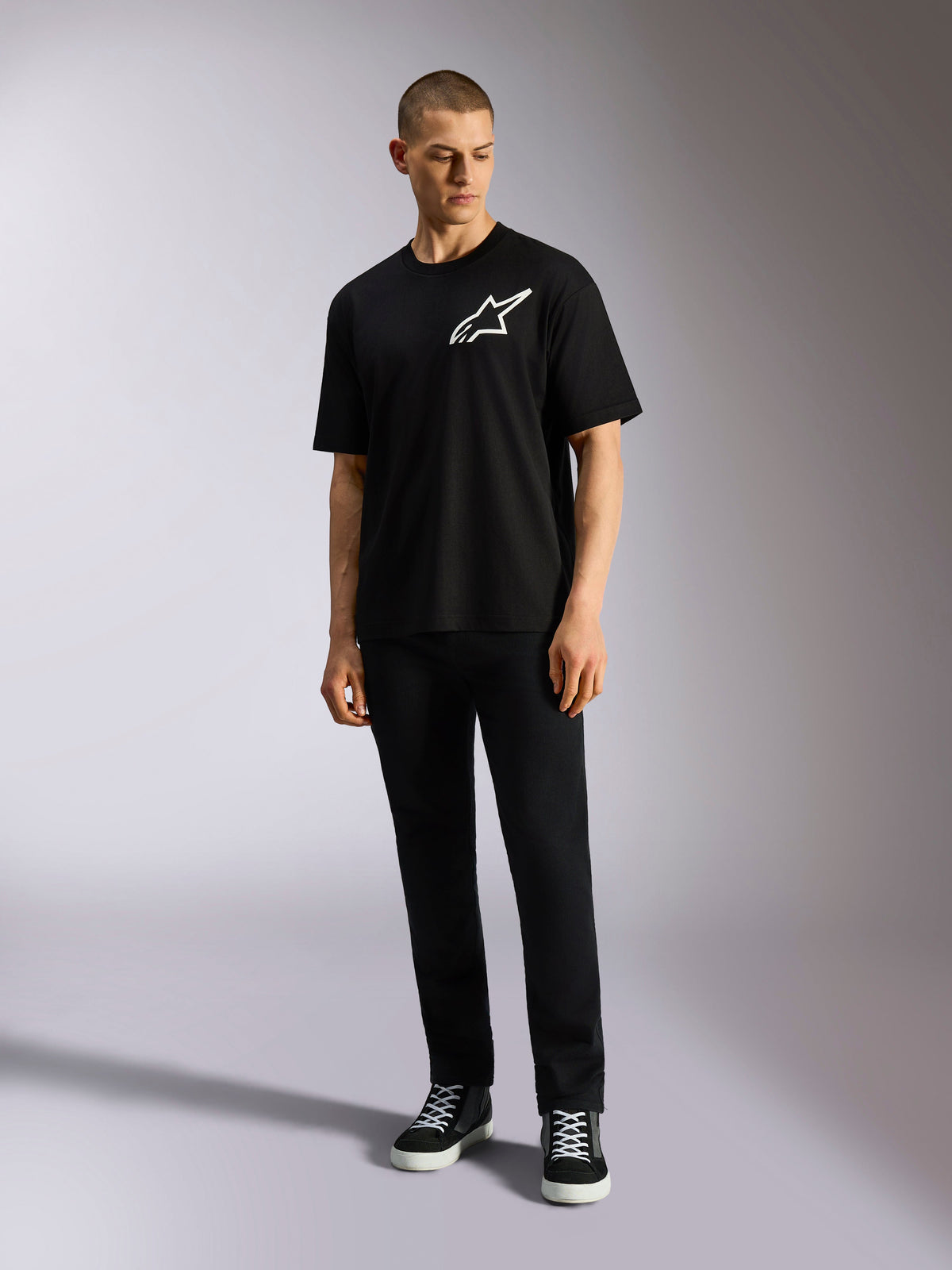 Alpinestars One Oversized CSF Tee, Short Sleeve T-Shirt, Black, White Astars Logo on chest, oversized fit, worn by model with black pants and sneakers, casual lifestyle streetwear