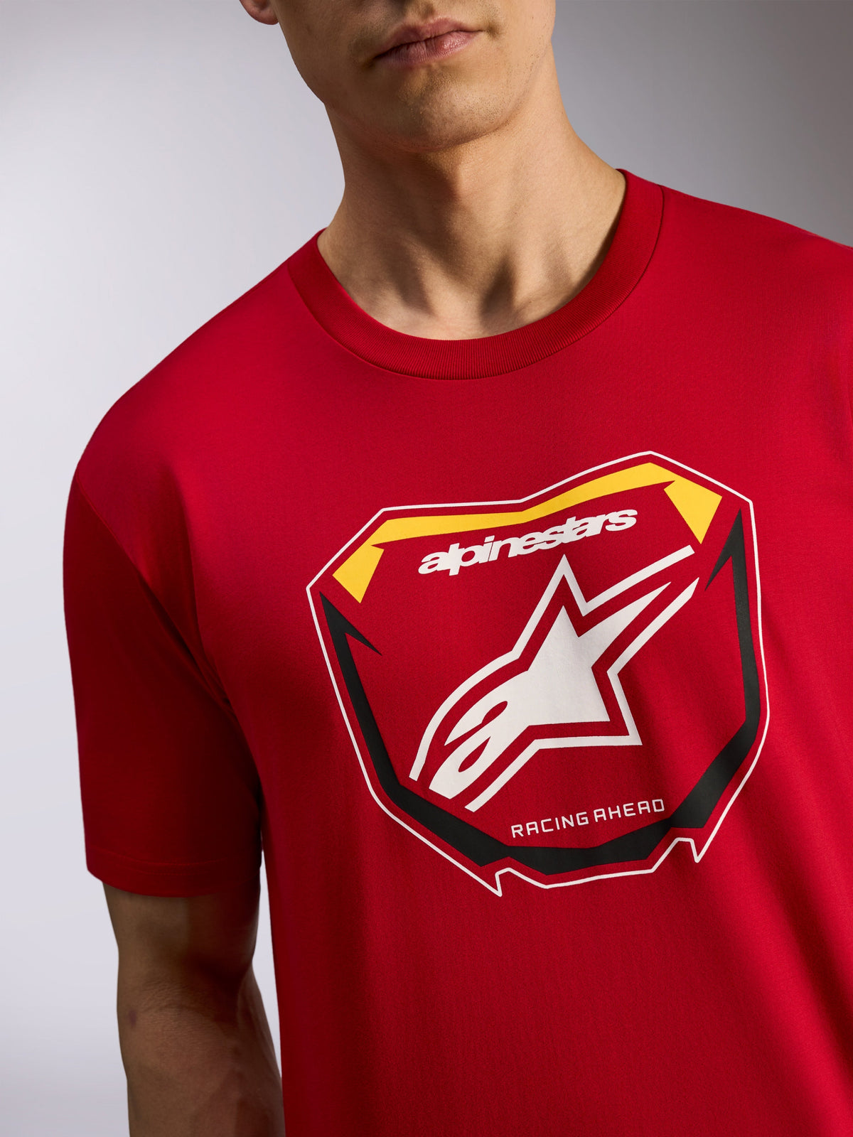 Alpinestars Plate CSF Tee, Short Sleeve T-Shirt, Red, featuring a front MX plate graphic with white star logo and "RACING AHEAD" text, casual motorsport streetwear