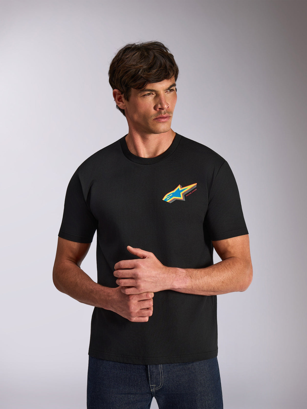 Alpinestars Angler CSF Tee, Short Sleeve T-Shirt, Black, vibrant multi-color Astars star logo on chest, casual motorsport-inspired streetwear worn by model