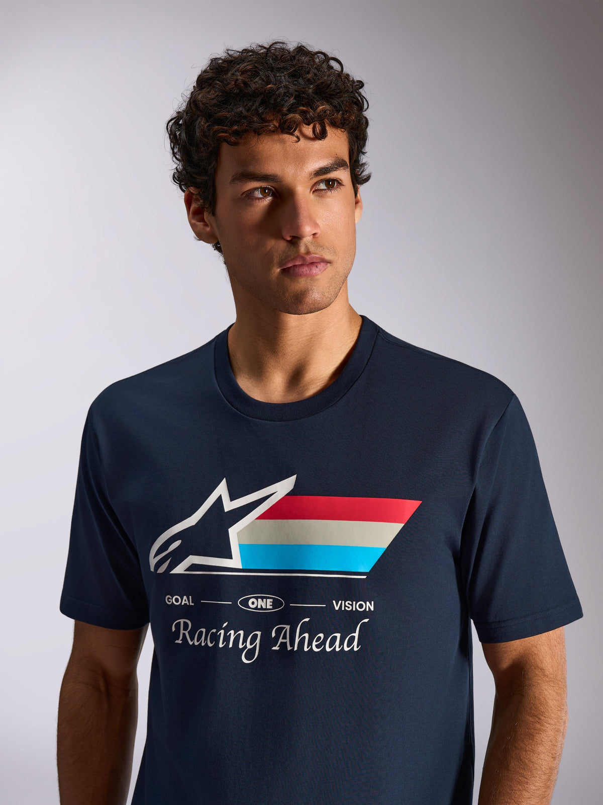 Alpinestars Trifecta CSF Tee, Short Sleeve T-Shirt, Navy Blue, White Astars Logo with Tri-color Stripes and 'Racing Ahead' text, Casual Motorsport Lifestyle Shot