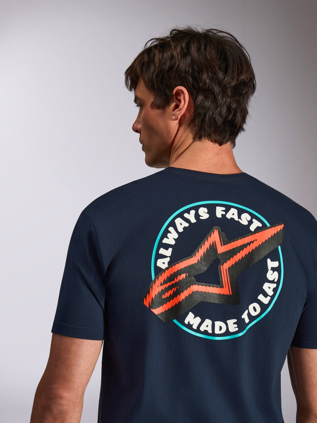 Alpinestars Aorbit CSF Tee, Short Sleeve T-Shirt, Navy, back view featuring Always Fast Made to Last graphic with orange star logo, casual motorsport streetwear