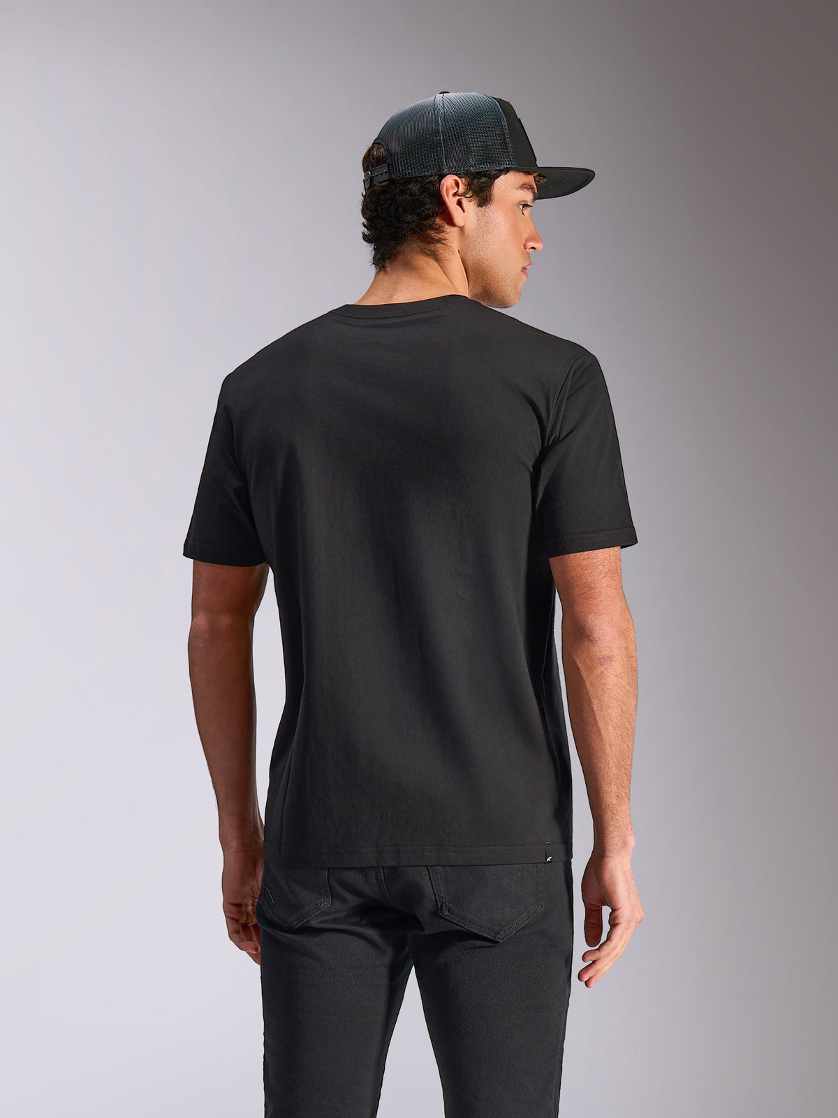 Alpinestars Verdure Camo CSF Tee, Short Sleeve T-Shirt, Black, Back View, worn with a mesh back cap and black pants, Casual Motorsport Streetwear