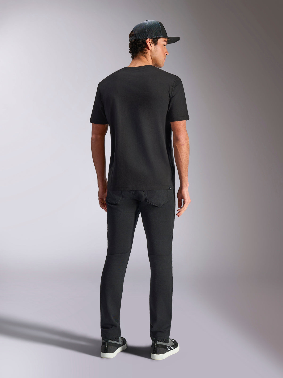 Alpinestars Verdure Camo CSF Tee, Short Sleeve T-Shirt, Black, back view, worn with black pants and a mesh cap, casual motorsport-inspired streetwear