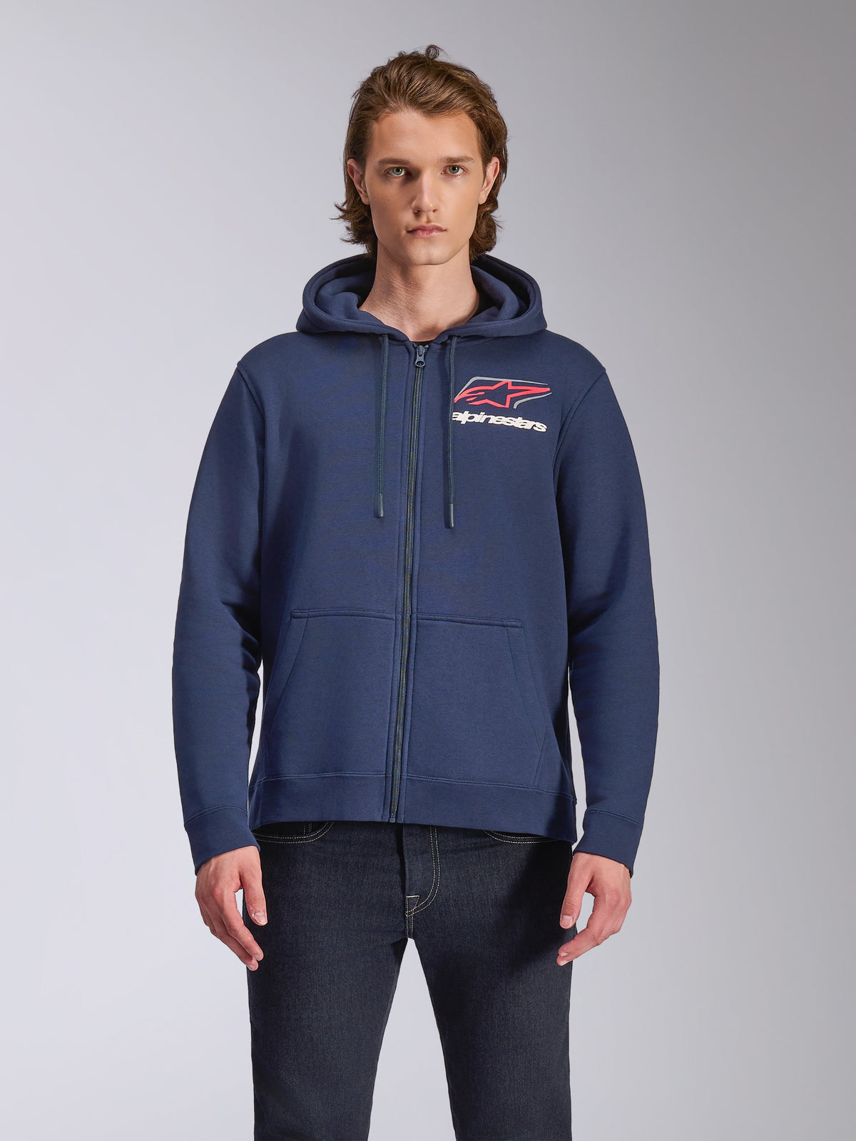 Alpinestars Formulation Hoodie, navy blue full-zip fleece hoodie, features large chest logo with red and white accents, mesh-lined hood with drawcords, casual motorsport-inspired streetwear
