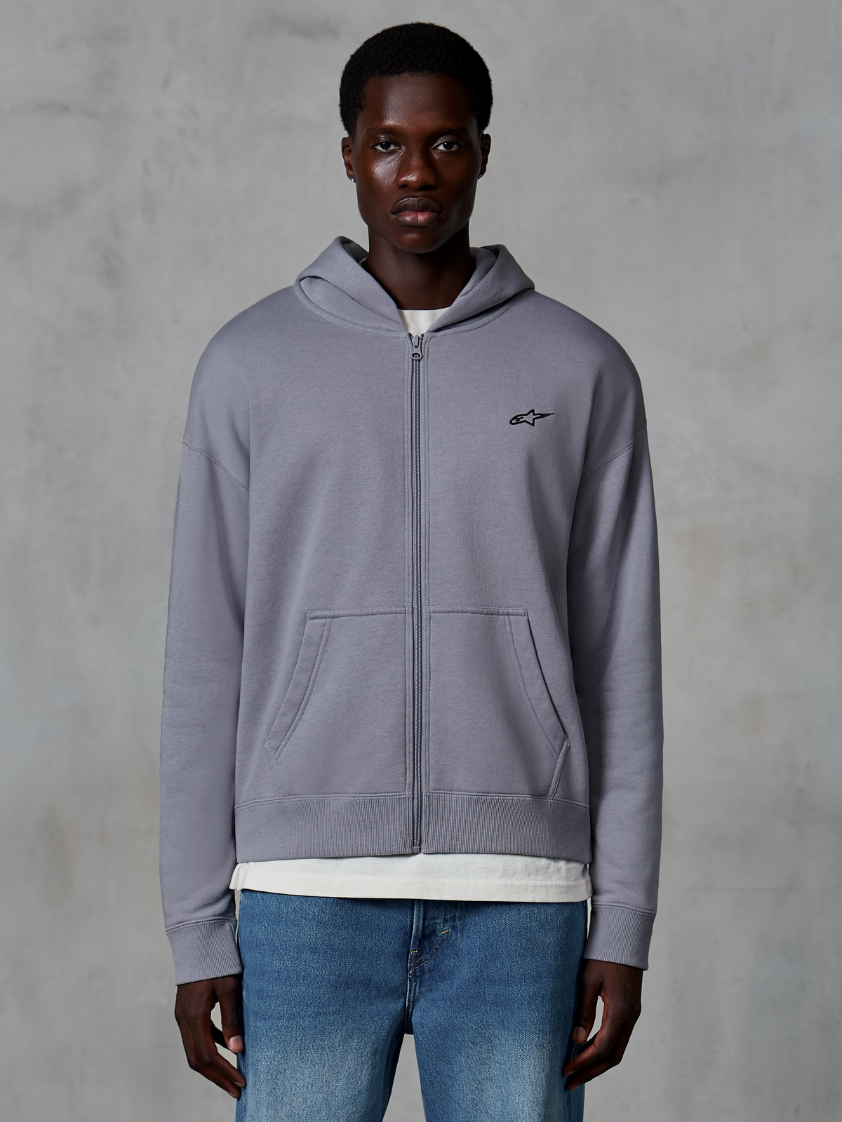 Alpinestars Essentials Ageless Zip Hoodie, Silver, casual streetwear worn by model, full-zip fleece with small black Astars logo on the chest, kangaroo pockets, relaxed fit design