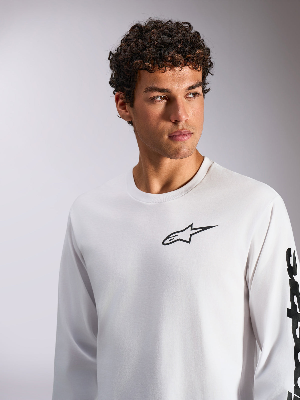 Alpinestars Trackside CSF Tee, Long Sleeve T-Shirt, White with Black branding, features the Astar logo on the chest and text on the sleeve, casual motorsport-inspired streetwear