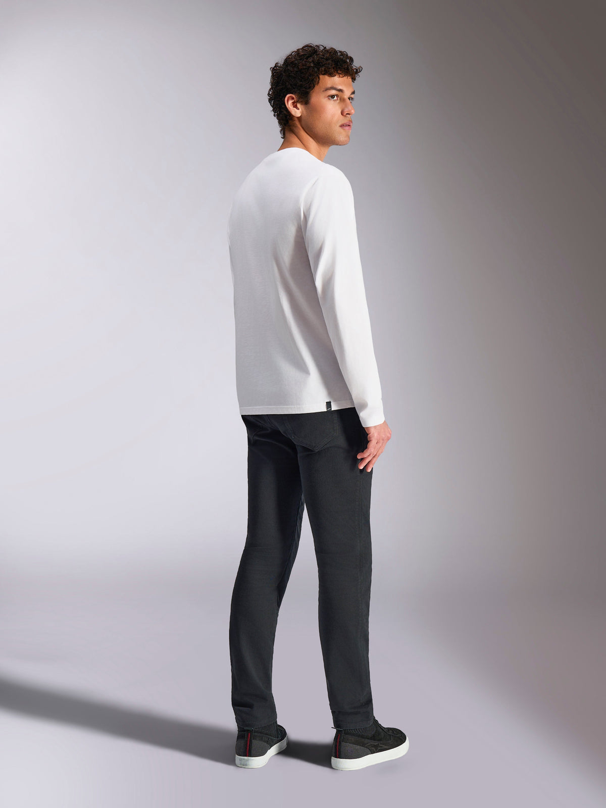 Alpinestars Trackside CSF Tee, Long Sleeve T-Shirt, White, male model viewed from the back wearing black pants, casual motorsport-inspired streetwear