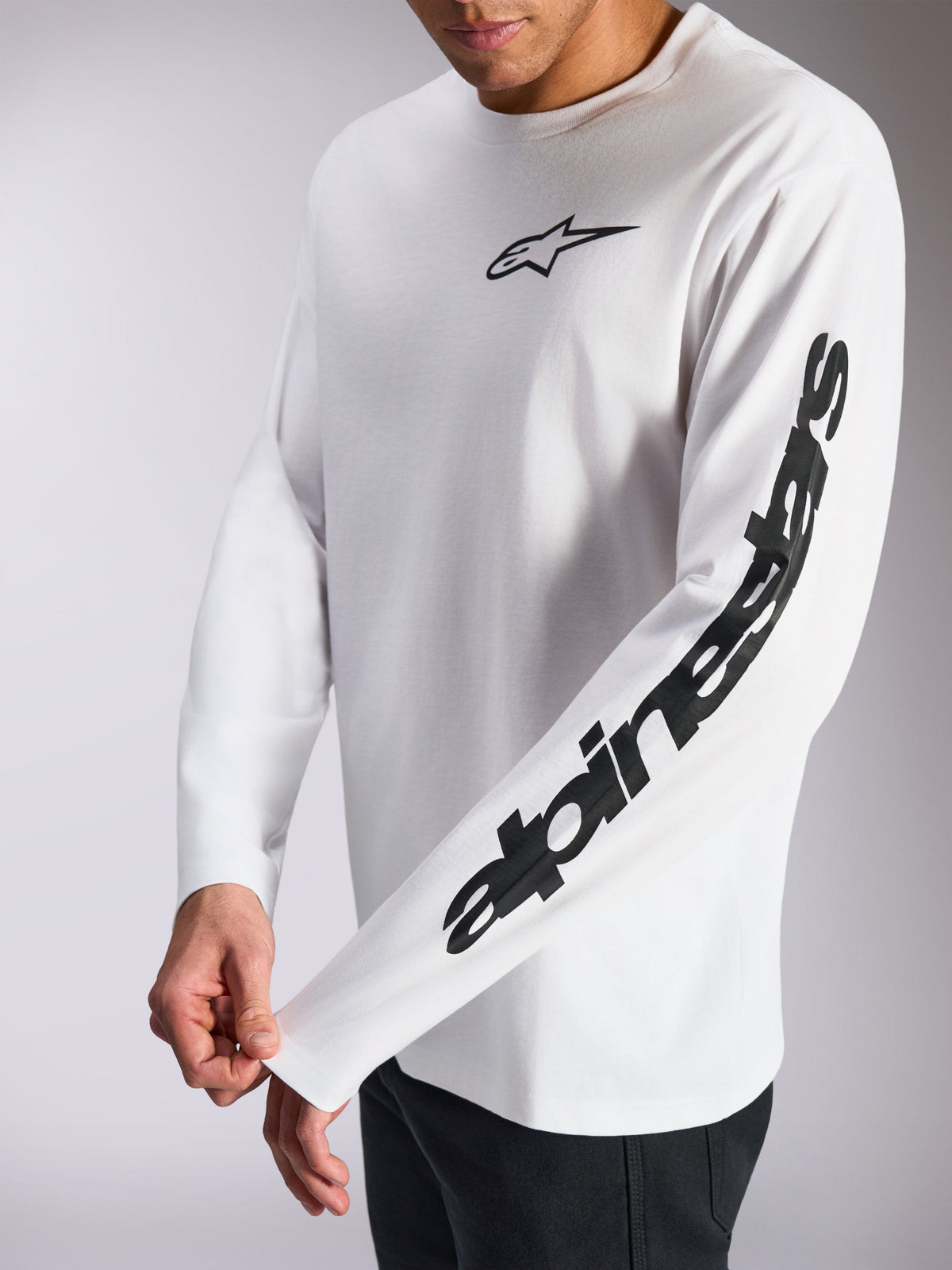 Alpinestars Trackside CSF Tee, Long Sleeve T-Shirt, White and Black, small black star logo on chest and bold wordmark branding on the sleeve, casual motorsport-inspired streetwear