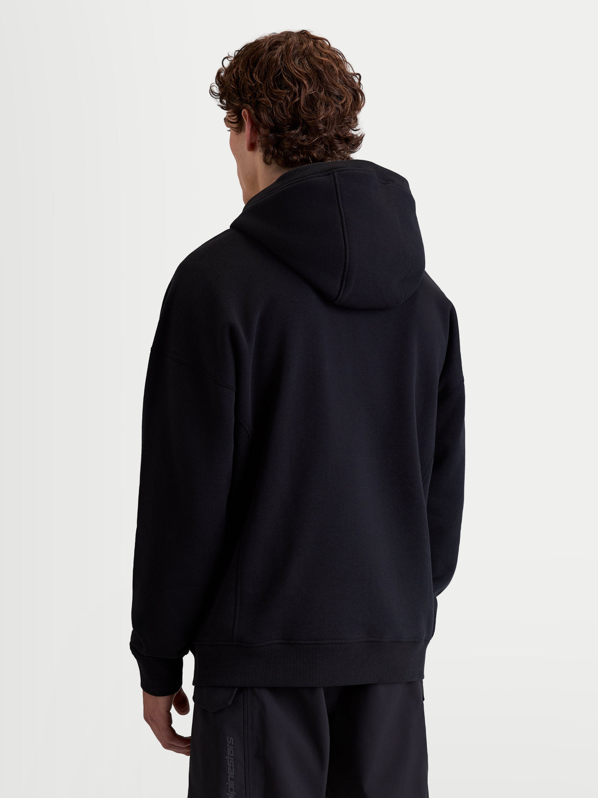 Alpinestars Shaw Oversized Hoodie, Men's and Women's Sportswear Pullover, Black, Rear View showing relaxed oversized fit, soft fleece cotton and recycled polyester blend with ribbed trims.