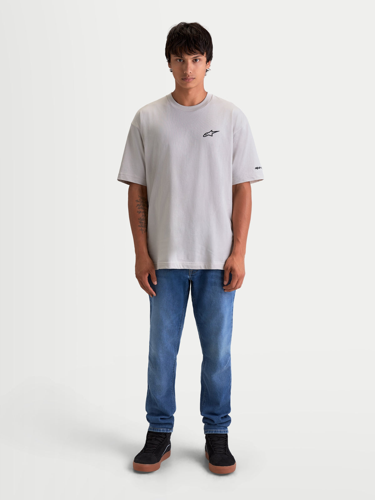 Alpinestars Mandate Oversized CSF Tee, Men's Short Sleeve Sportswear T-shirt, Cement Gray, featuring a relaxed oversized fit, black puff-print Astars logo on the chest, and sleeve graphics, cotton-poly blend for casual lifestyle wear.