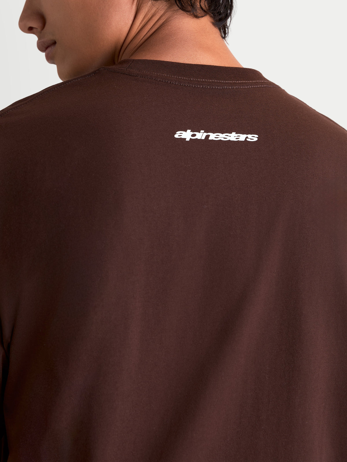Alpinestars Prelude Oversized CSF Tee, brown short-sleeve sportswear t-shirt featuring a white Alpinestars logo graphic on the back, relaxed oversized fit, soft cotton-poly blend.