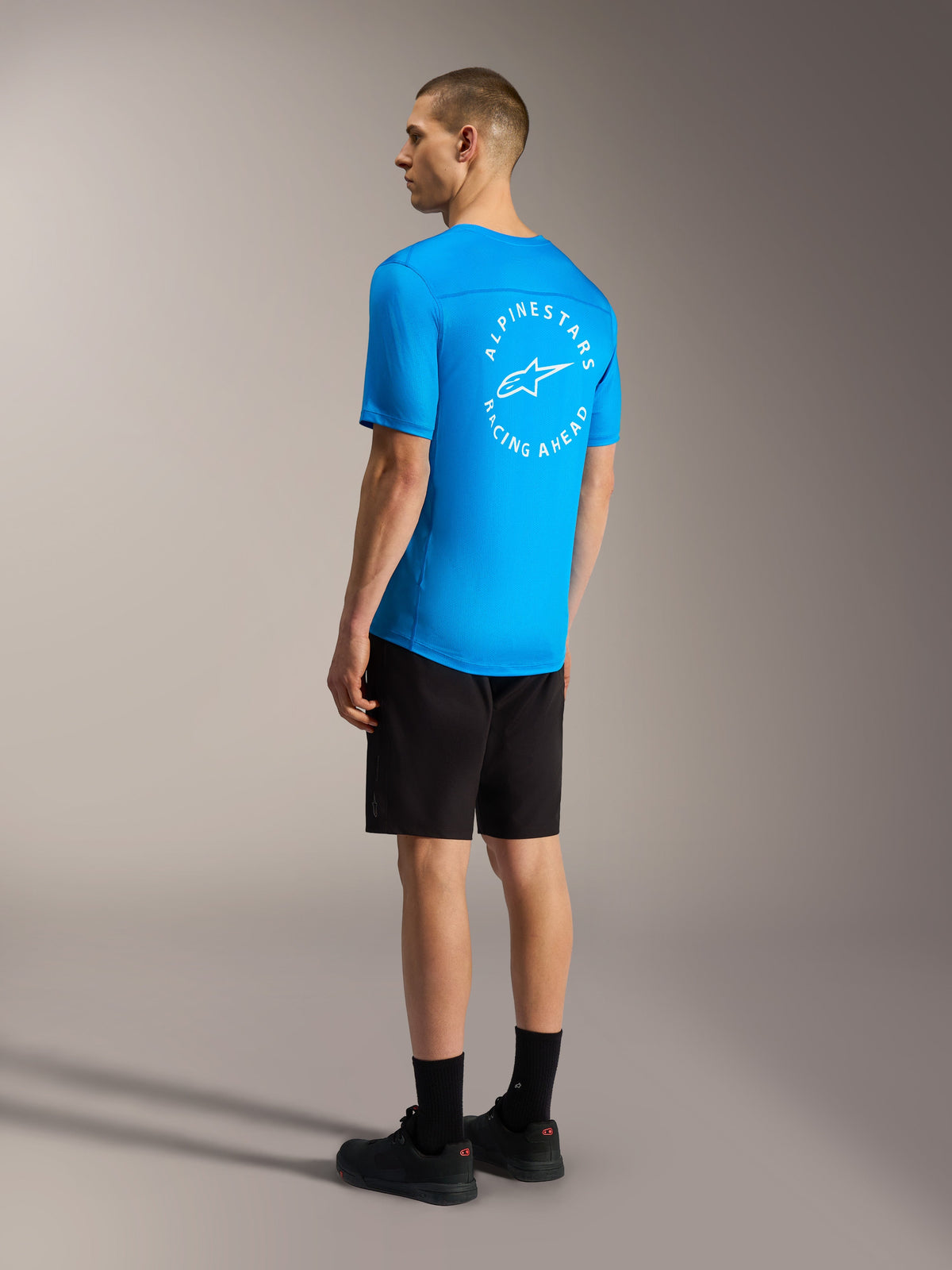 Bright blue A-Dura Air SS Jersey with white circular back logo and black A-Dura Ride Shorts for mountain biking.