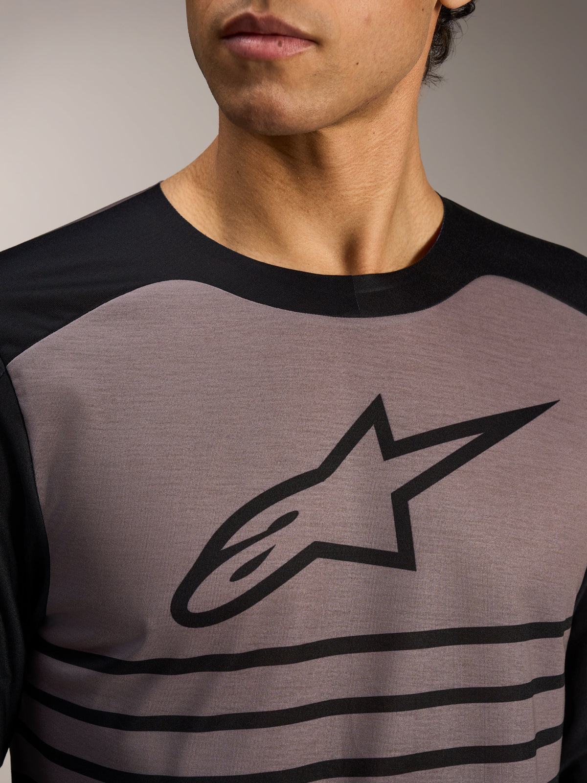 Alpinestars A-Dura Elite Jersey 2.0, grey and black long-sleeve MTB jersey with bold Astars logo and stripe details.