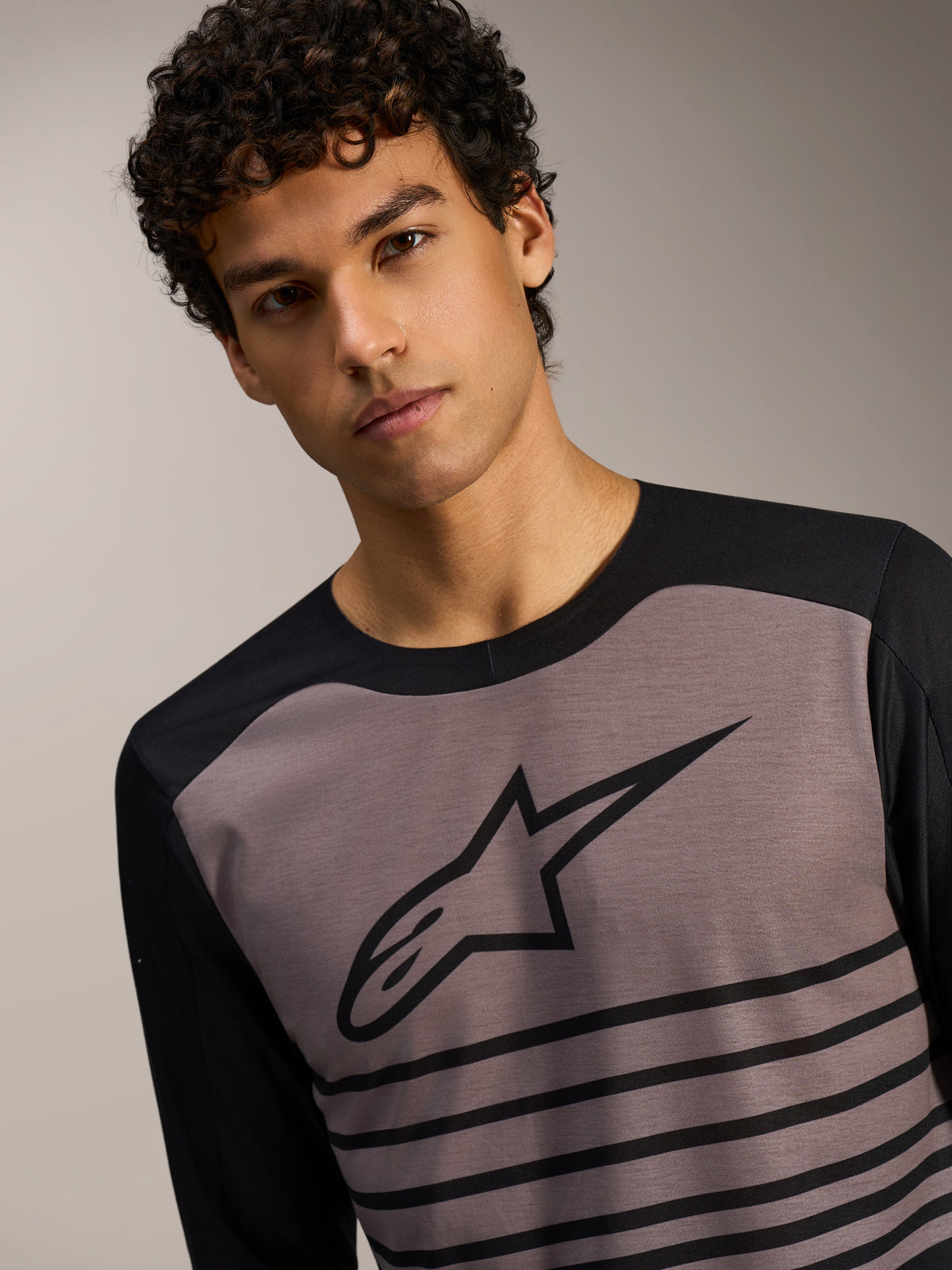A-Dura Elite Long Sleeve Jersey 2.0, black and grey MTB top with a striped chest design and Alpinestars logo.