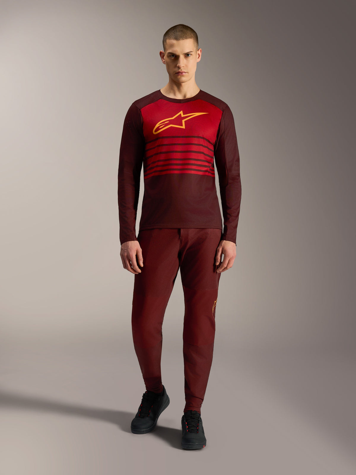 Alpinestars A-Dura Elite Jersey 2.0 Long Sleeve in Bordeaux, featuring a yellow chest logo and red stripes.