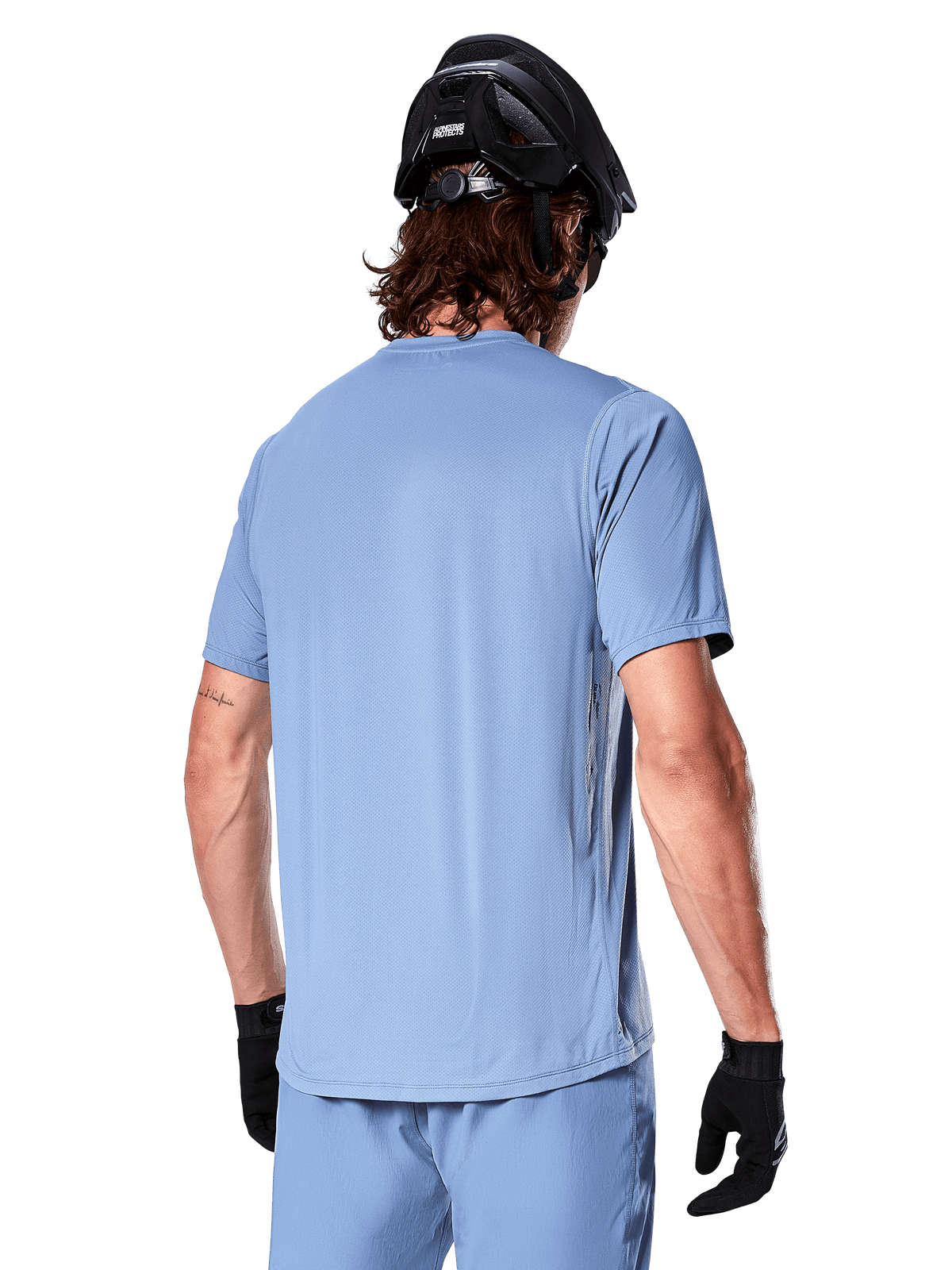 Alpinestars A-Dura Astar Short Sleeve Men's MTB Jersey in Infinity Blue, rear view on a rider for off-road trail riding.