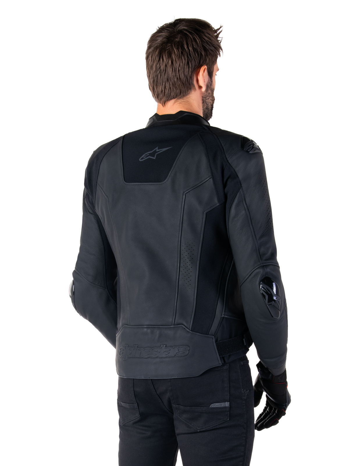 Alpinestars Missile V3 Leather Jacket, Black, rear view on model, premium racing sport jacket with leather construction, featuring embossed Alpinestars branding on the lower back and TPU elbow sliders.