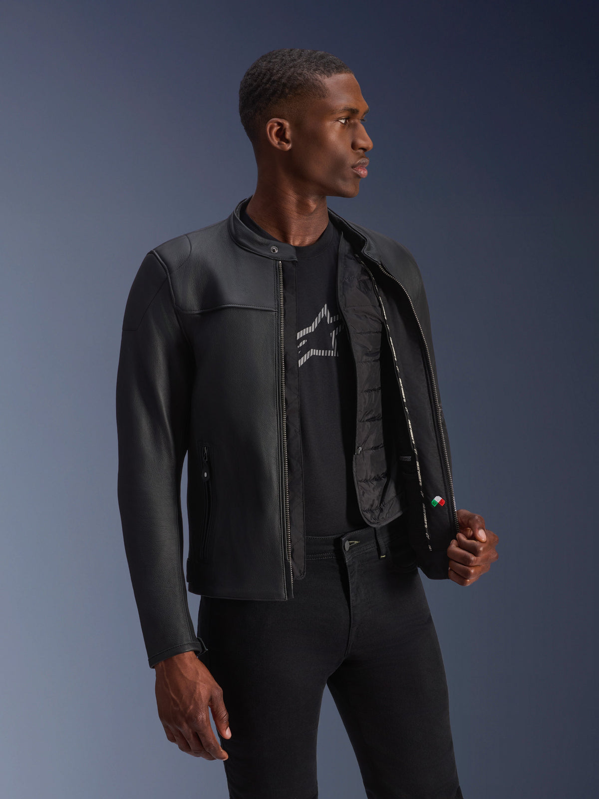 Alpinestars Blacktrack Leather Jacket, black bovine leather, unzipped on a model showing the thermal vest.