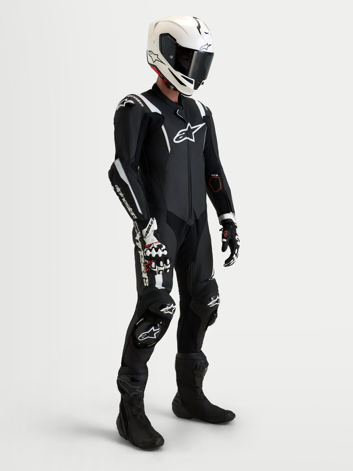 Alpinestars Missile V3 Leather Suit - 1 Piece, men's black and white 1-piece racing leather suit with integrated DFS armor and Tech-Air compatibility, shown worn on a model with matching helmet, boots, and gloves for trackday and sport riding