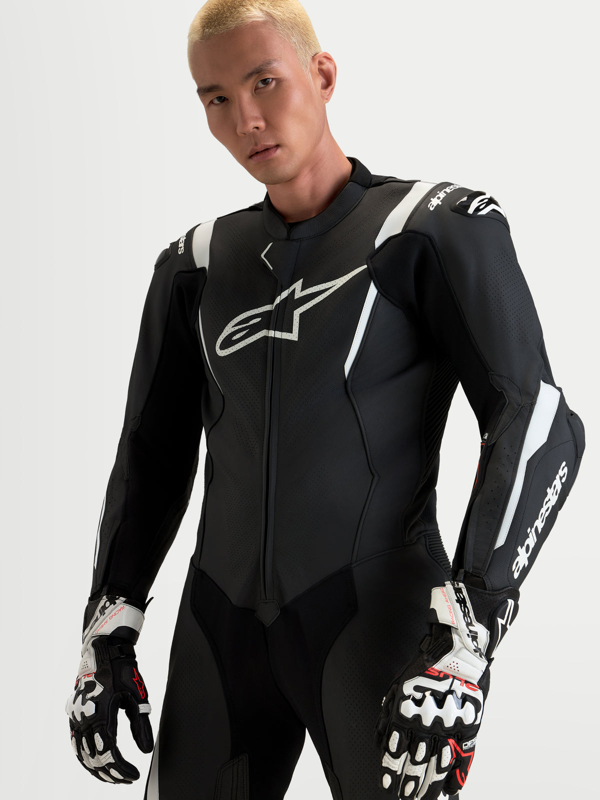 Alpinestars Missile V3 Leather Suit - 1 Piece, men's black and white leather motorcycle racing suit featuring integrated DFS armor and ventilated panels, worn by a model