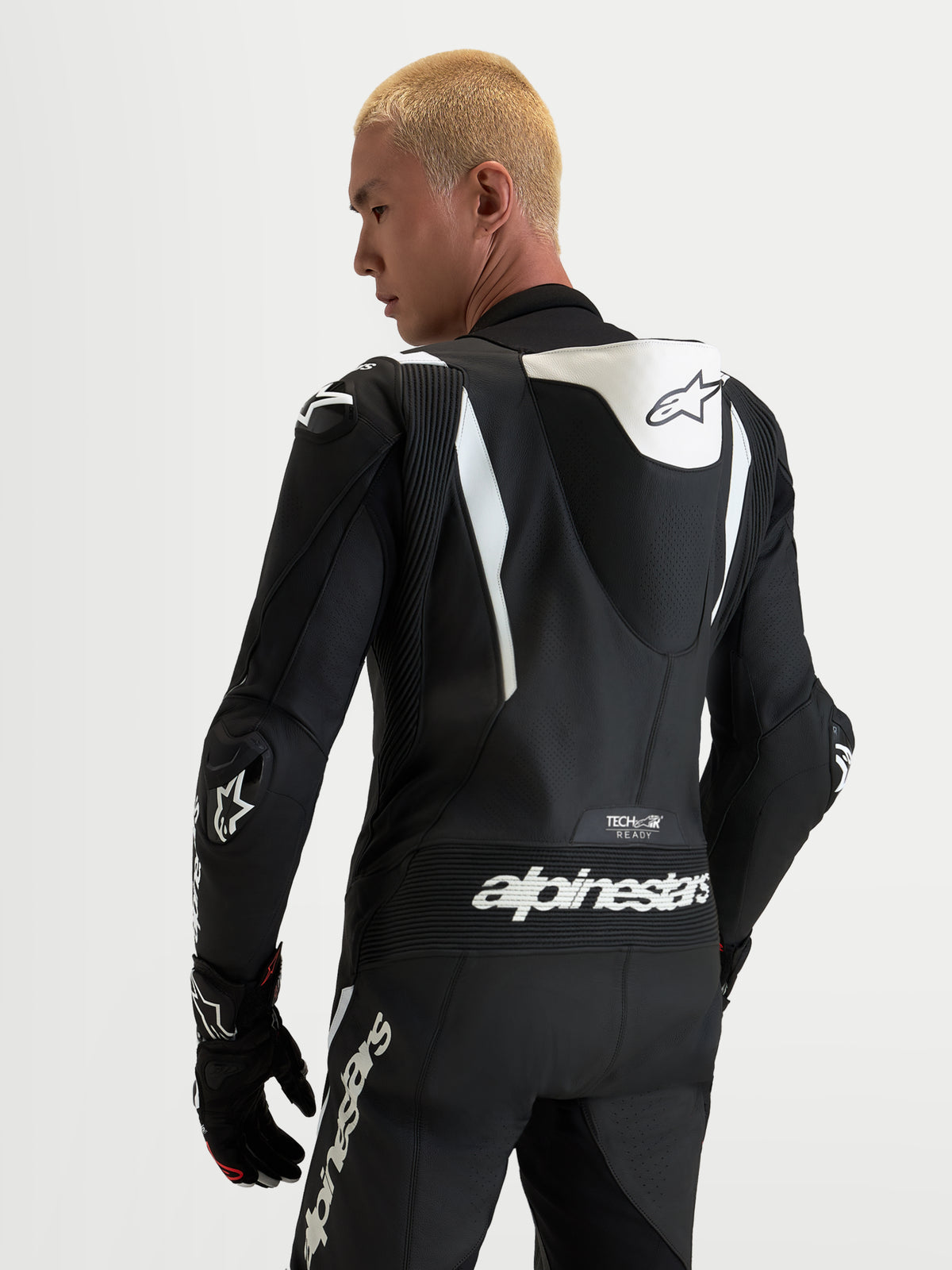 Alpinestars Missile V3 1-Piece Leather Suit, Men's motorcycle racing suit, Black and White, featuring an aerodynamic speed hump, Tech-Air ready branding, and DFS shoulder armor