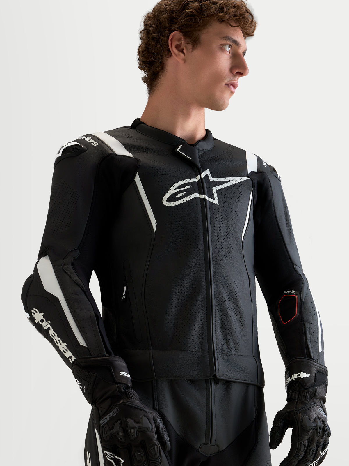 Alpinestars Missile V3 Leather Suit 2 Piece, Black and White men's motorcycle racing leather suit, featuring aerodynamic shoulder sliders, perforated detailing, and premium cowhide construction