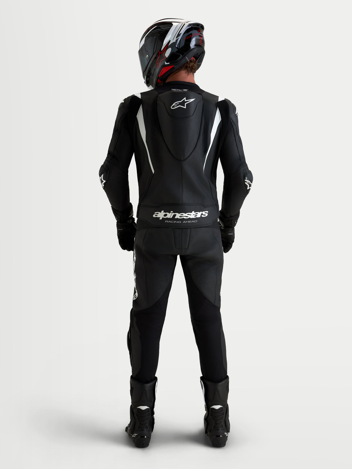 Alpinestars Missile V3 Leather Suit 2 Piece, Black and White, men's two-piece motorcycle racing leather suit, rear view showing aerodynamic speed hump and Alpinestars branding