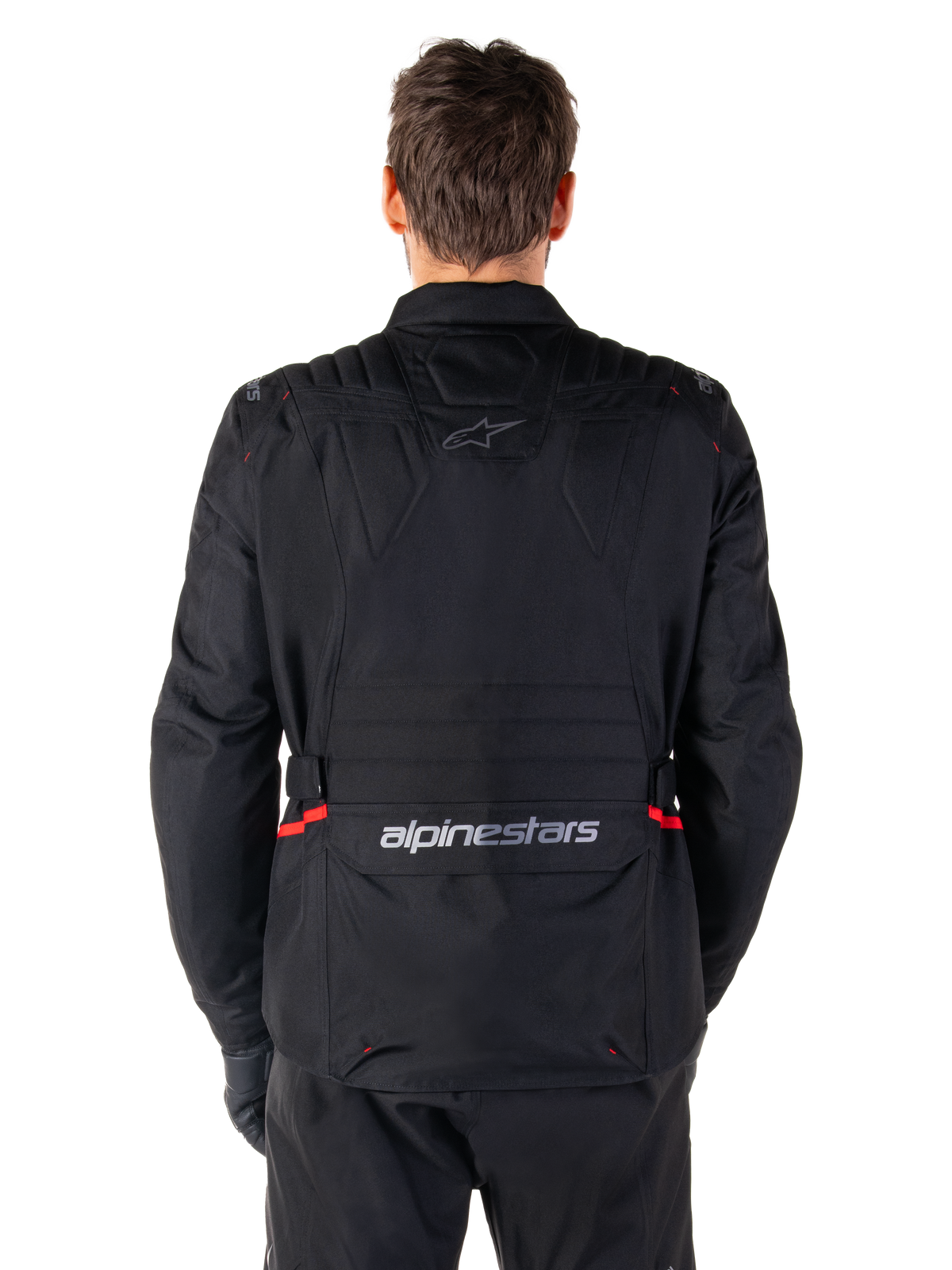 Alpinestars ST-1 Waterproof Jacket, Black, Back View, adventure touring motorcycle jacket featuring red accents on the waist, Alpinestars logo on the upper back, and wordmark on the lower back flap