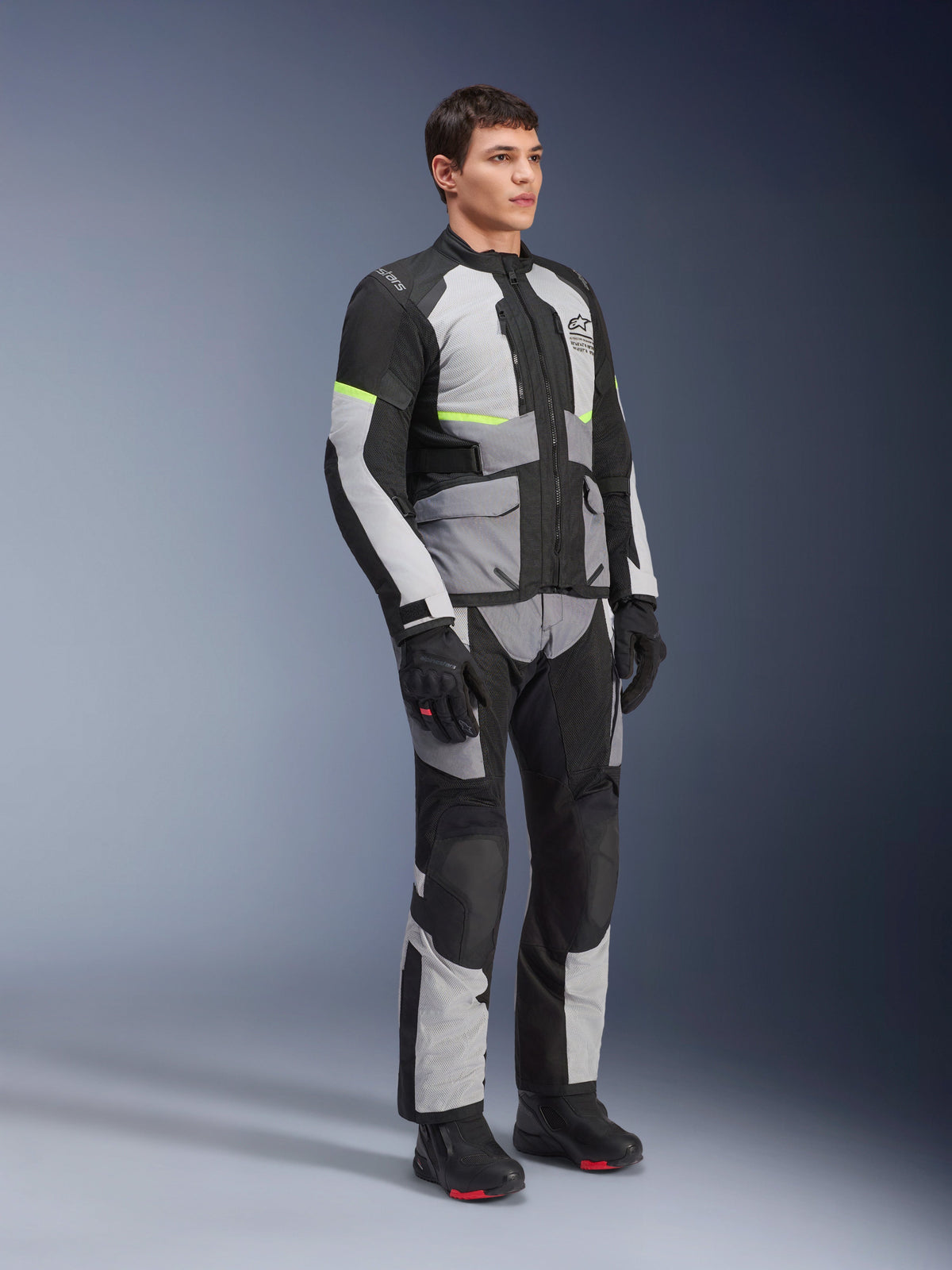 Alpinestars Andes Air Drystar® Jacket and Pants, Adventure Touring Motorcycle Gear, Ice Gray Dark Gray and Black with neon yellow accents, worn with black gloves and boots, full-body studio shot for dual-season touring.