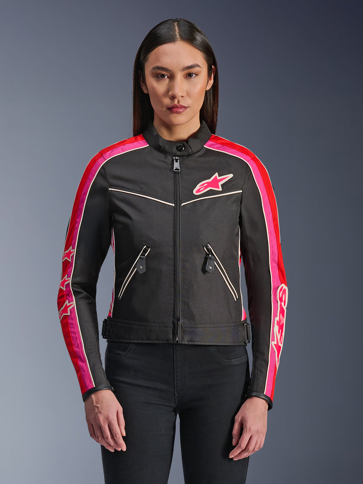 Alpinestars Stella T-Dyno WR Jacket, Women's Textile Motorcycle Jacket, Black with Bright Red and Fuchsia accents, featuring fuchsia stripes and star logos on the sleeves and chest, zippered pockets, and a vintage-inspired biker fit