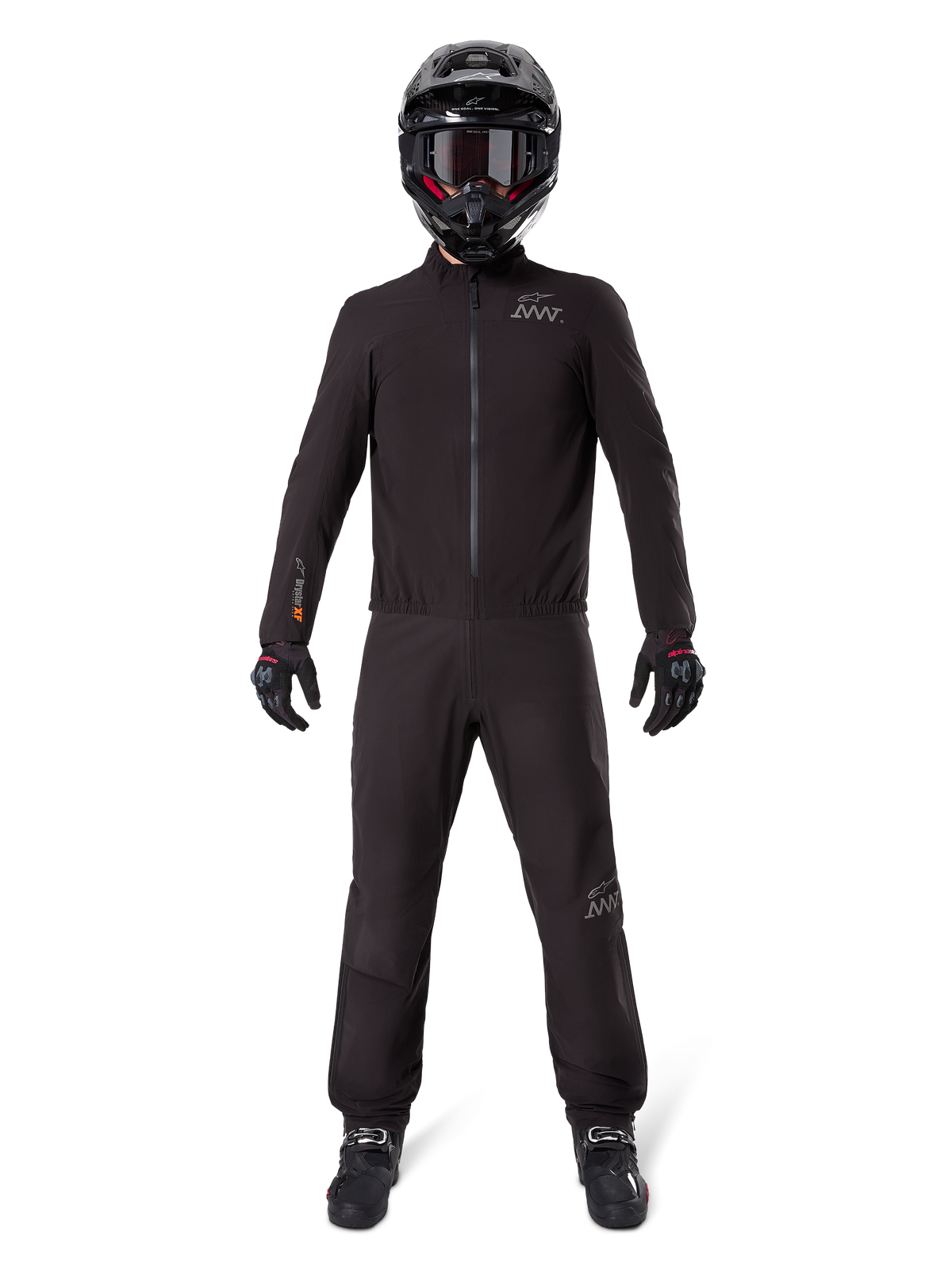 Motorcycle rider wearing Alpinestars AMT-8 Stretch Drystar® XF Pant Liner and matching jacket, all-black waterproof and windproof technical gear, featuring a black helmet, gloves, and boots, sleek adventure touring design.