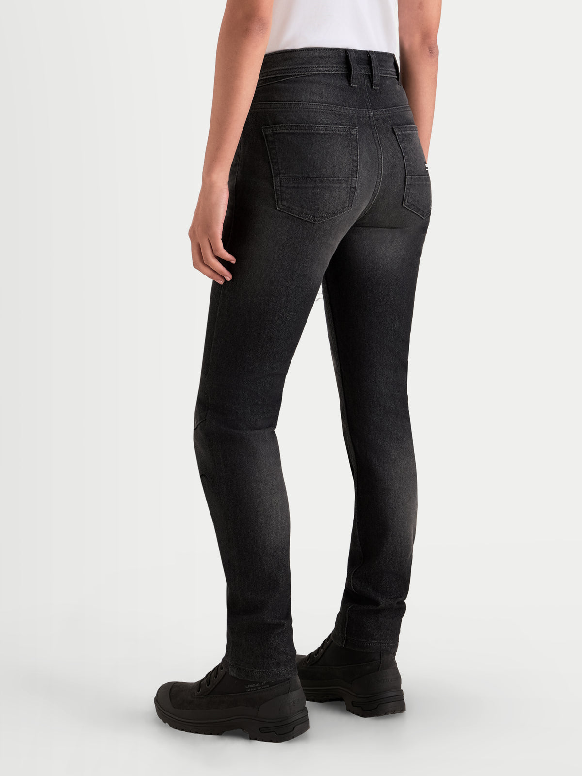 Alpinestars Stella Flex-AST 7 Denim Pants, women's urban motorcycle riding jeans, faded black, rear view showing single-layer technical denim construction and slim fit worn by a model