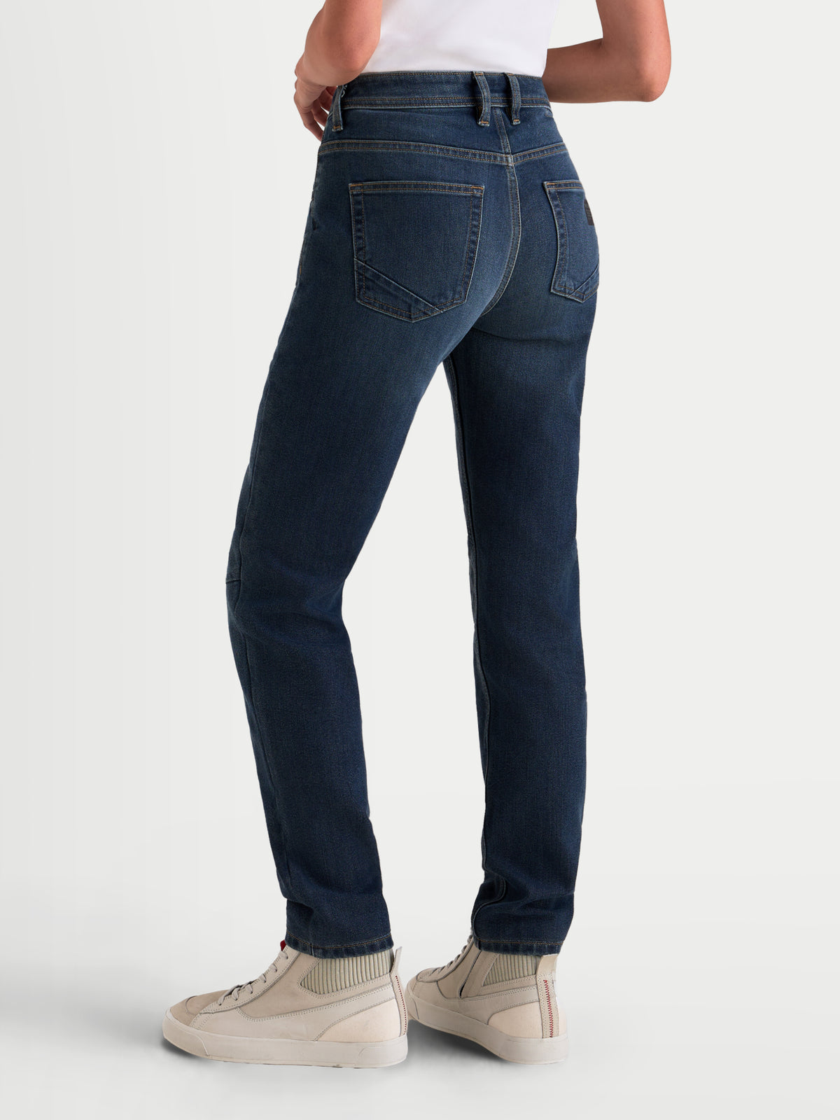 Alpinestars Stella Flex-AST 5 Denim Pants, women's urban motorcycle riding jeans, indigo washed blue, rear view showing single-layer stretch construction and ergonomic waist fit worn by a model