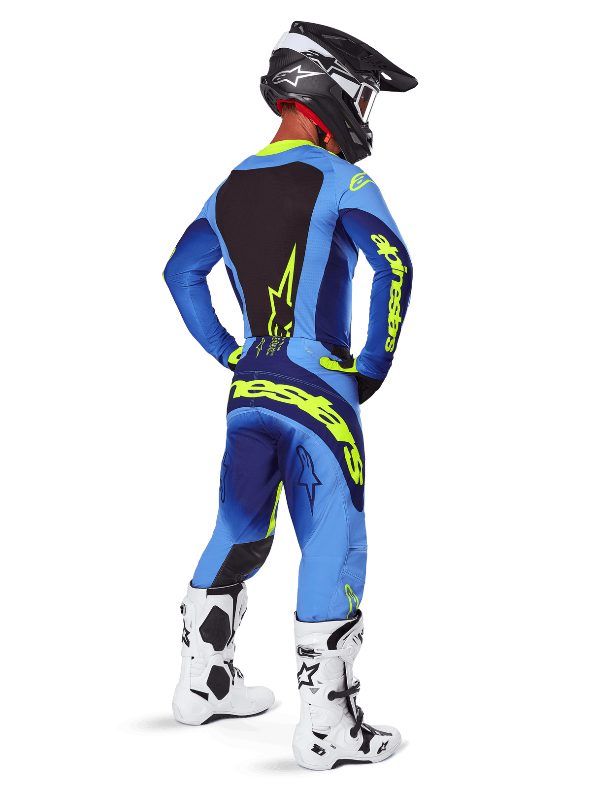 Alpinestars 2025 Techstar Melt Pants, Motocross Gear, Yellow Fluo Blue, rear view of rider wearing matching blue jersey with large yellow branding, white and black boots, and black helmet, coordinated racing outfit for off-road performance