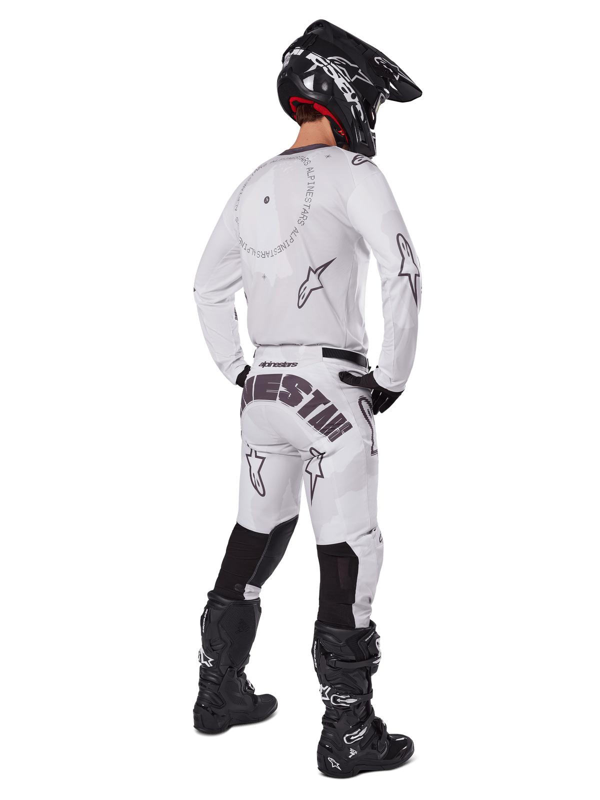 Alpinestars 2025 Racer Hollow Pants, Motocross Pants, Light Camo Brown and White, rear view showing bold black branding on the seat and star logos, worn with matching jersey, black boots, and black helmet for a complete off-road racing look