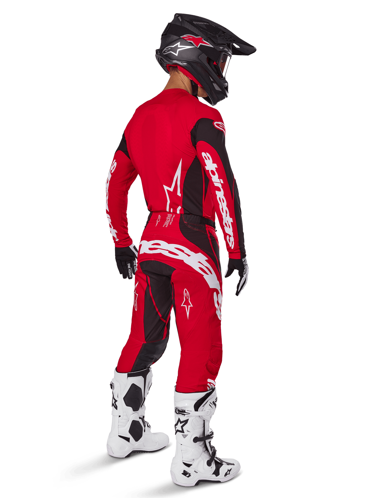 Motocross rider wearing the Alpinestars 2025 Techstar Dreem Gear Set in Bright Red and Black, featuring white branding on the jersey and pants, paired with a black helmet, white and black boots, and black and white gloves, rear three-quarter view.