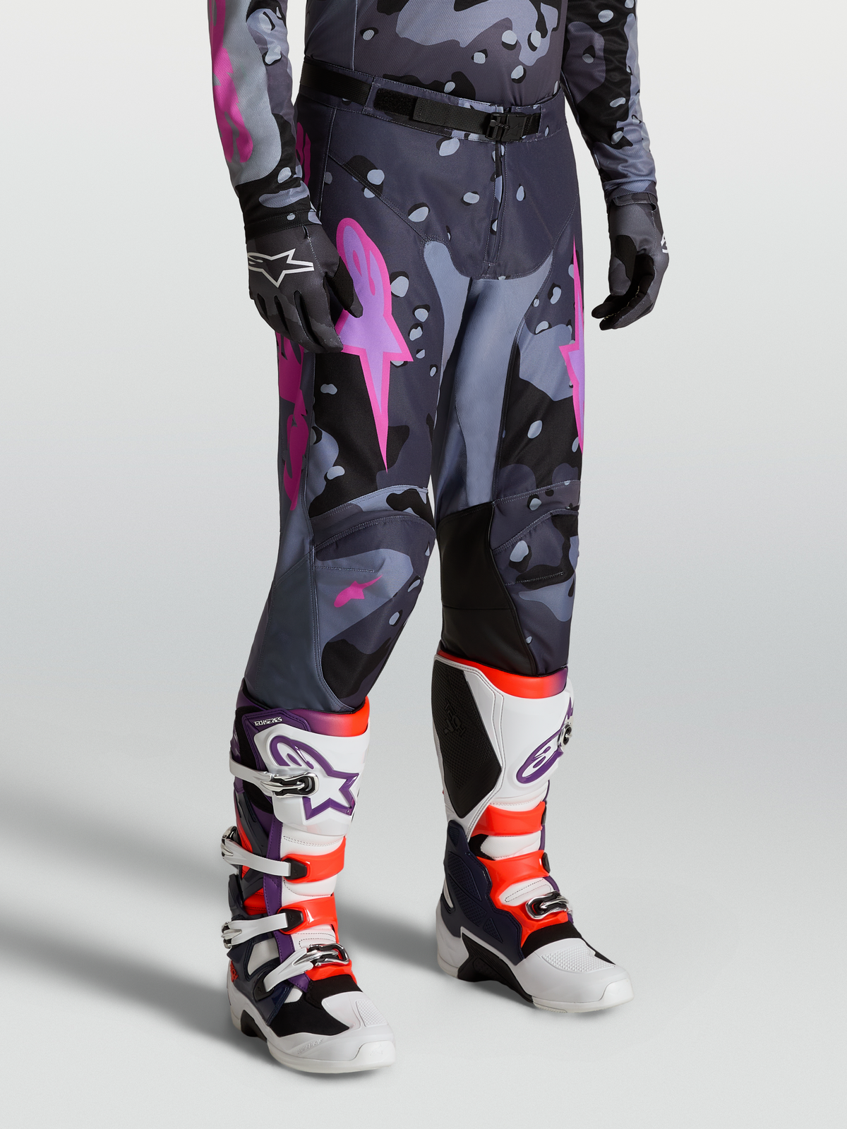 Alpinestars Racer Lone Pants, Gray Camo and Purple Motocross Pants for men, featuring a pre-curved race fit, 600D polyfabric, leather inner knee panels, and ergonomic stretch inserts for off-road performance.