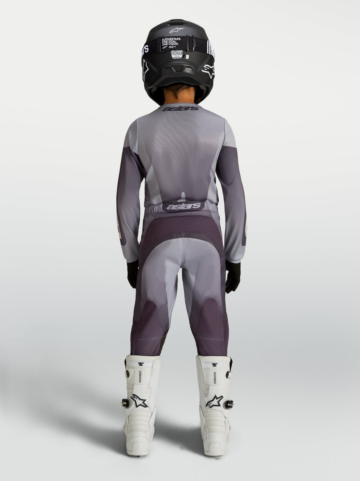Alpinestars 2027 Youth Fluid Amber Jersey and Gear Set, gray and purple motocross racing gear, rear view on youth rider.