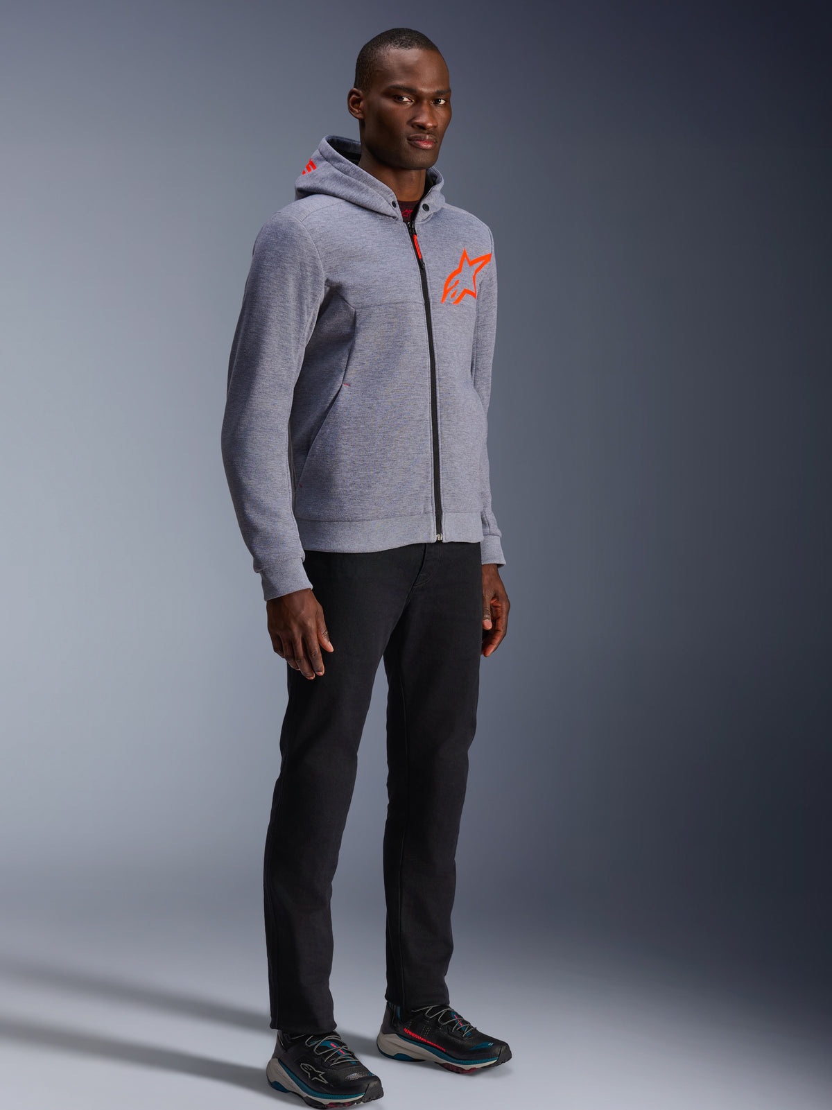 Alpinestars Chrome V2 Sport Hoodie in Gray Heather and Red Fluo, a protective urban riding hoodie worn by a male model.