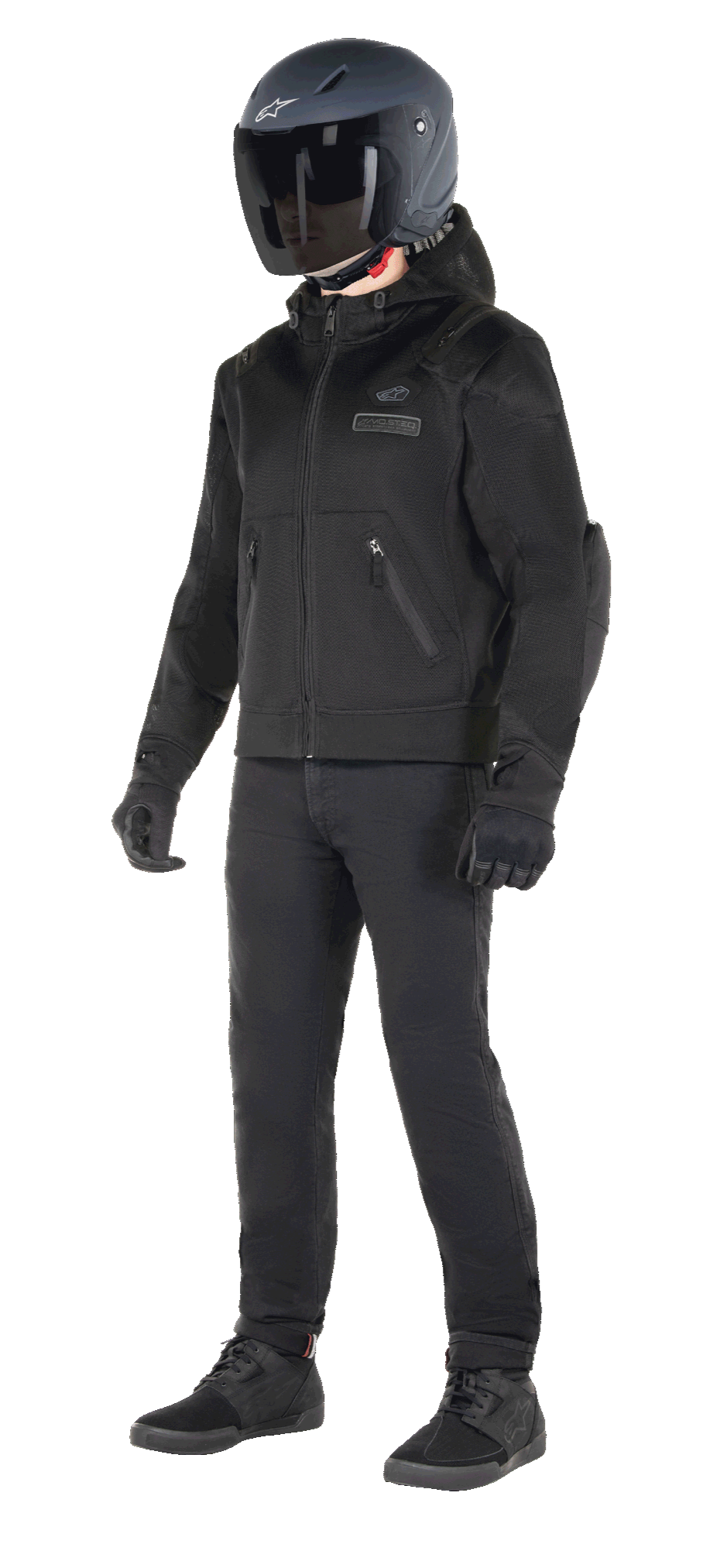 Alpinestars Moflow Air Tech Hoodie, Urban Motorcycle Hoodie, Black Black, worn by a rider with a matte black helmet, black gloves, and riding pants, featuring a full mesh construction for airflow, zippered pockets, and subtle chest logos, sleek casual design for warm weather street riding.
