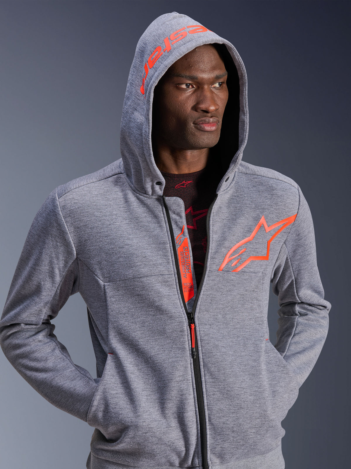 Alpinestars Chrome V2 Sport Hoodie, gray heather urban motorcycle jacket with red fluo logo and hood up.