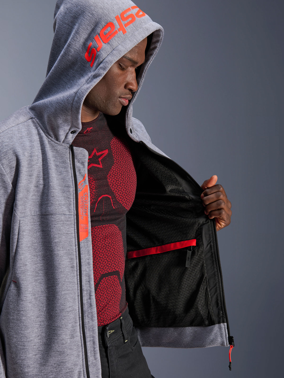 Alpinestars Chrome V2 Sport Hoodie, Gray and Red urban motorcycle hoodie on model with mesh and Tech-Air Ready label.