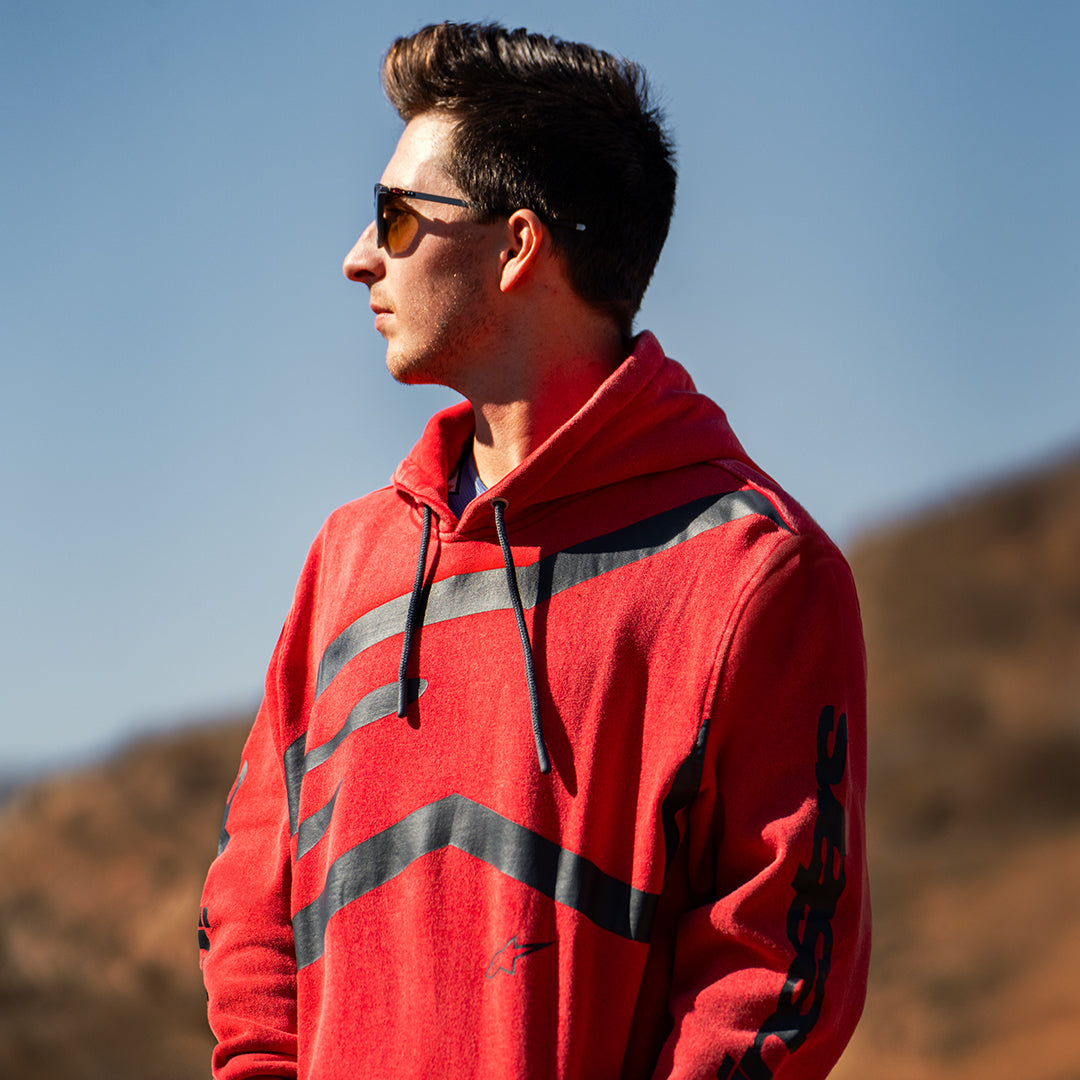 Alpinestars Unbound Hoodie, Red garment-dyed fleece, featuring an extra-large black logo on the chest and Alpinestars wordmark on the sleeves, drawstring hood, casual motorsport-inspired streetwear